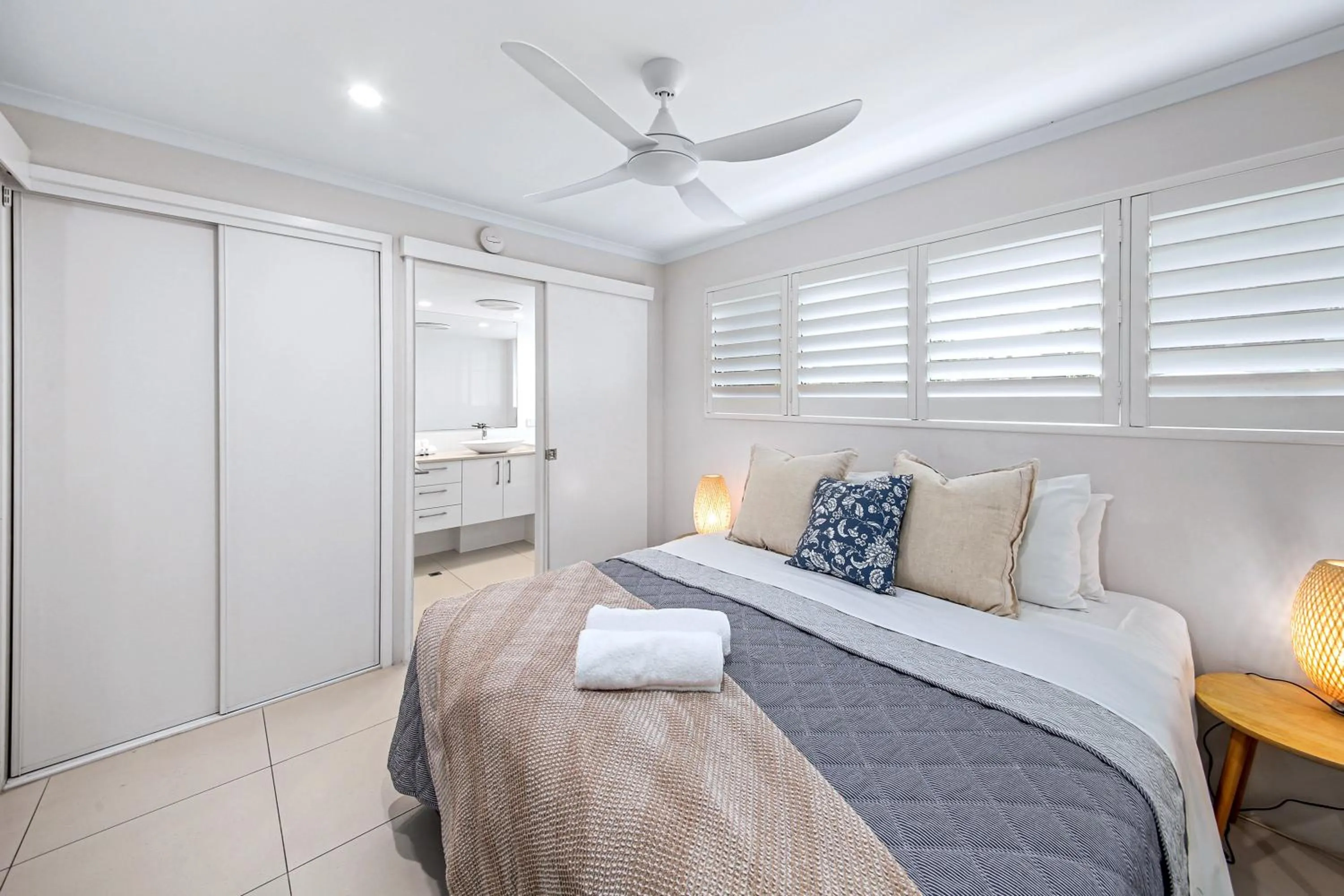 Bed in Chez Noosa Holiday Apartments