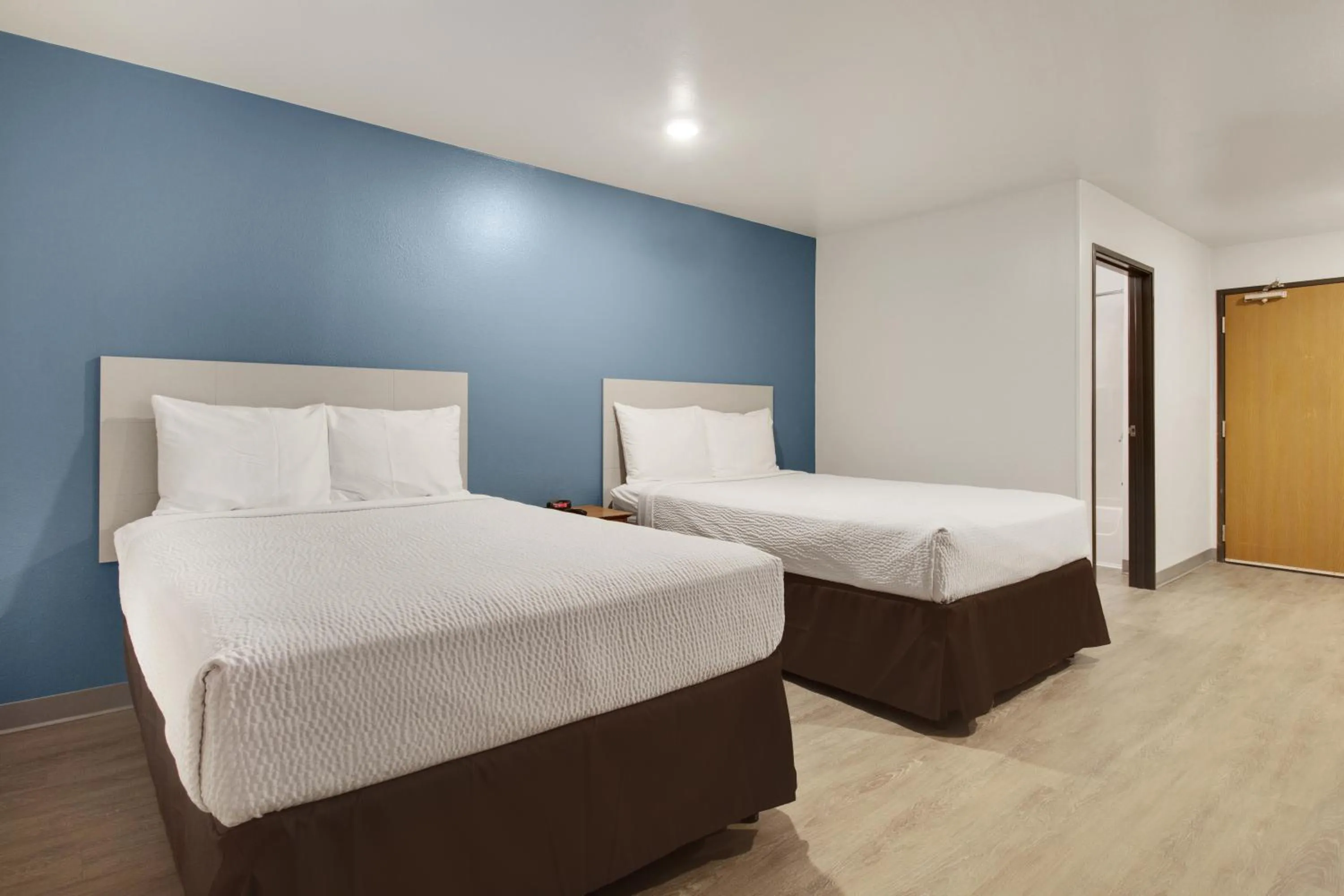 Bed in WoodSpring Suites Texas City