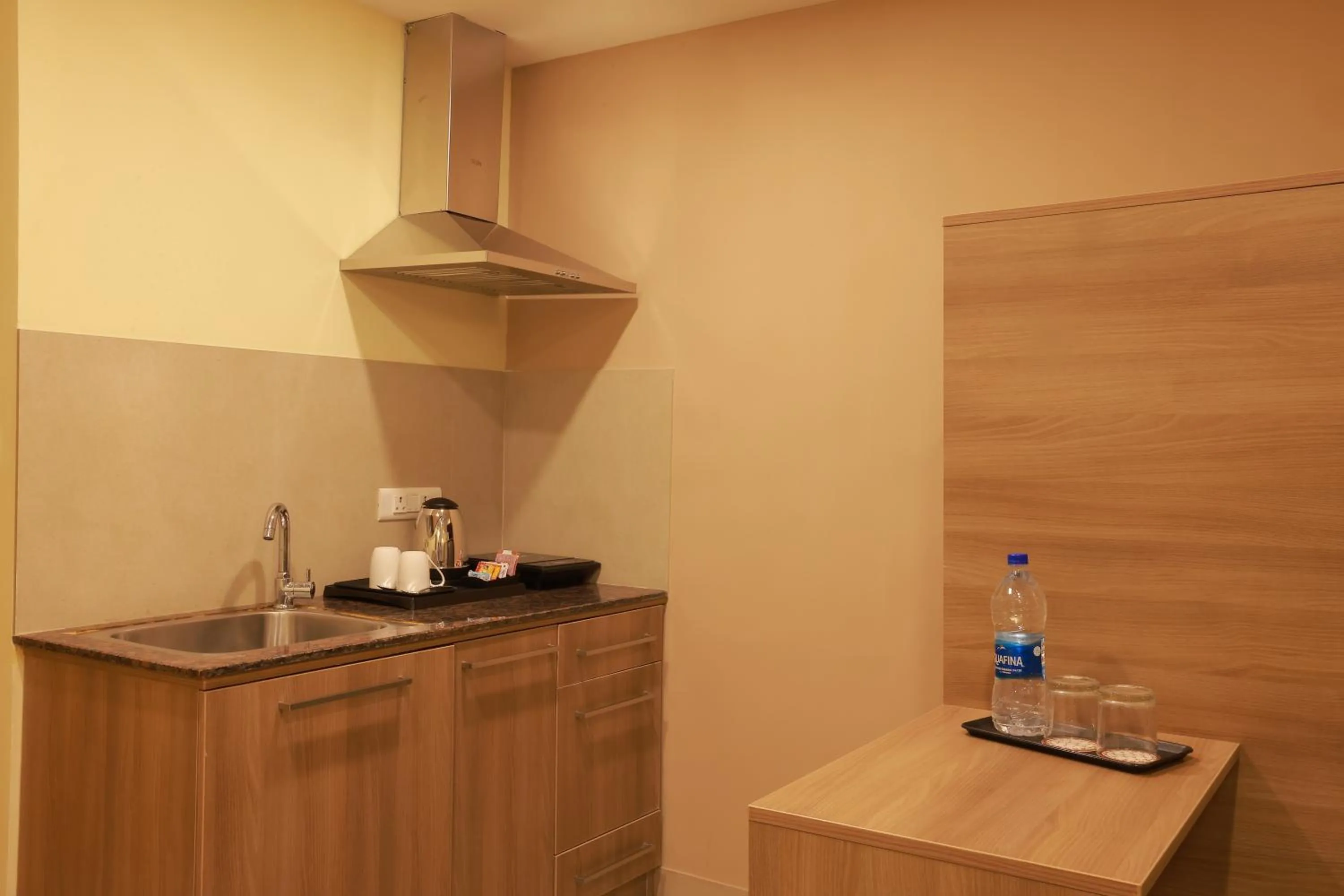 Kitchen or kitchenette in Starlit Suites Tirupati
