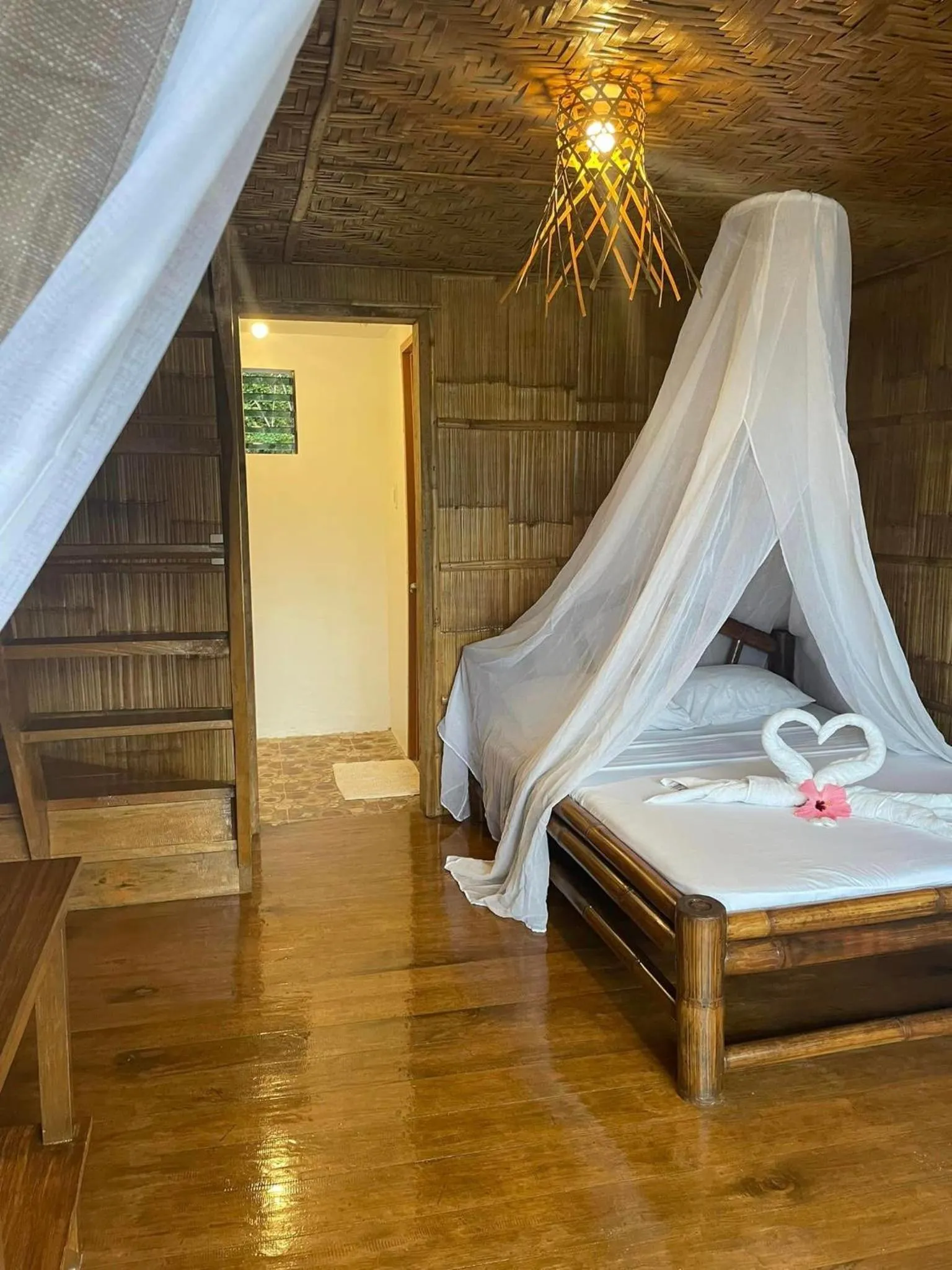 Bed in Camiguin Blue Lagoon Cottages