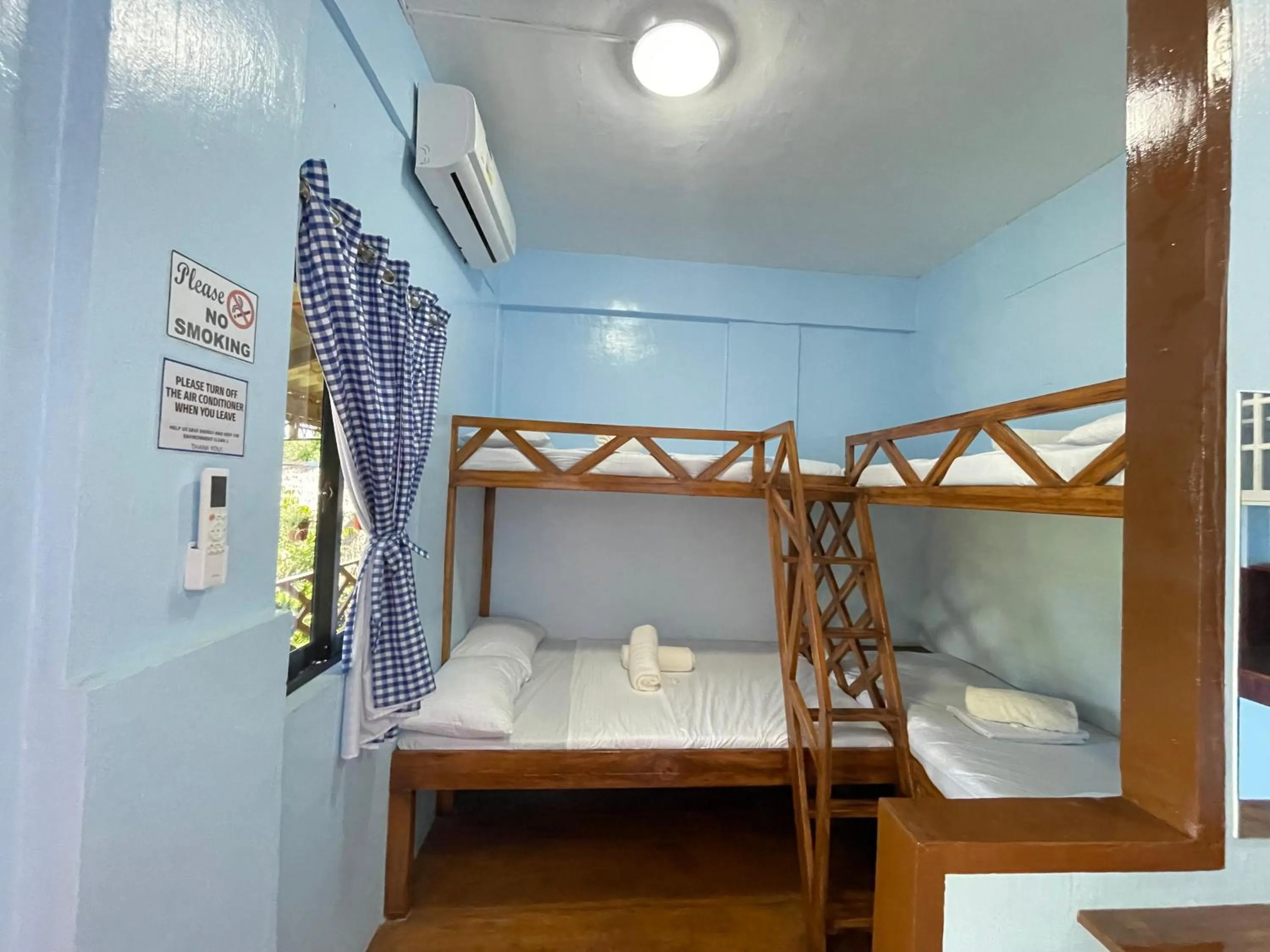 Bed in Camiguin Blue Lagoon Cottages