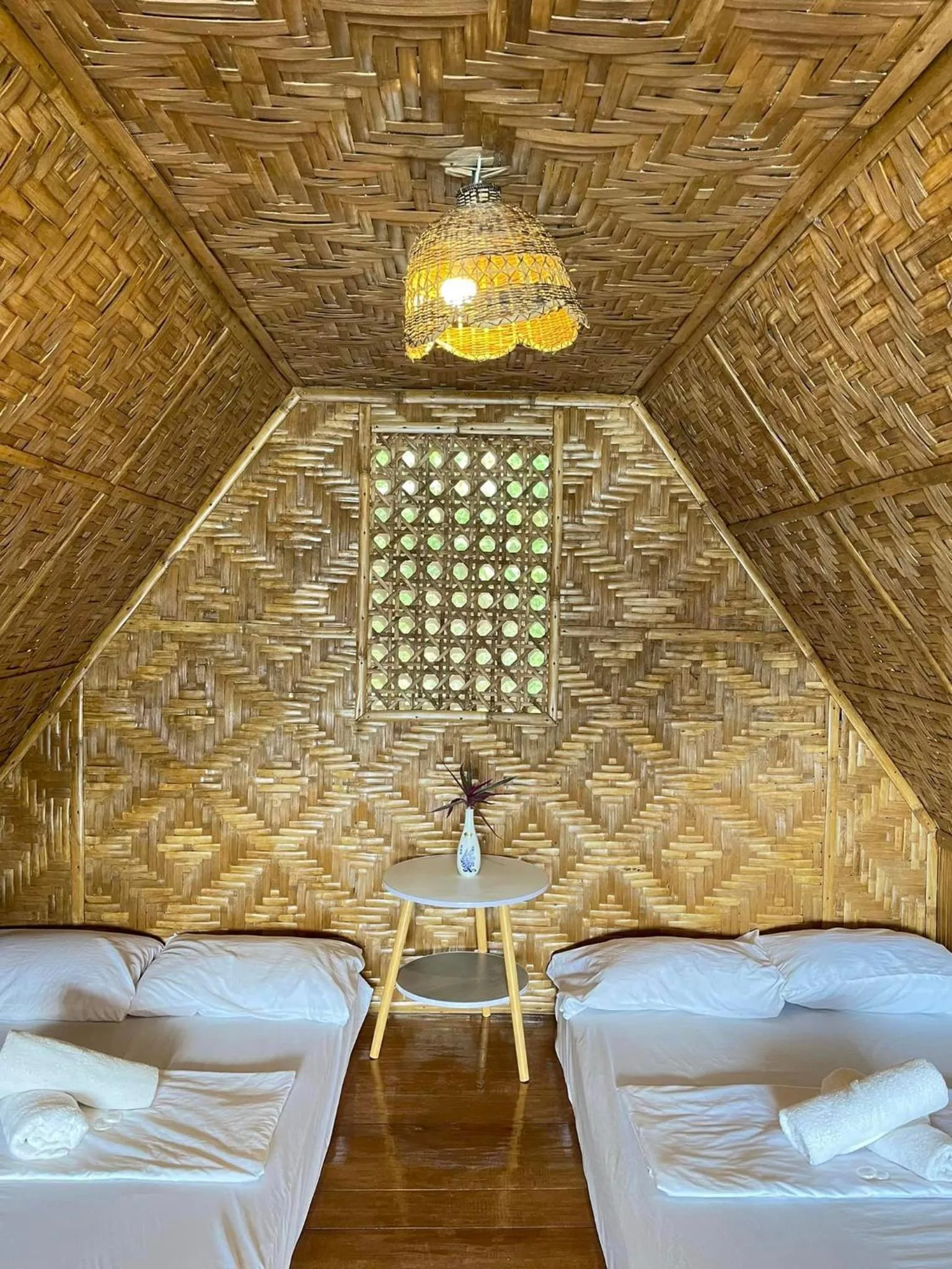 Bed in Camiguin Blue Lagoon Cottages