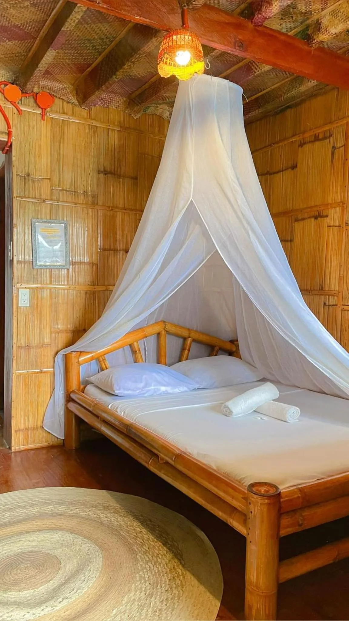 Bed in Camiguin Blue Lagoon Cottages