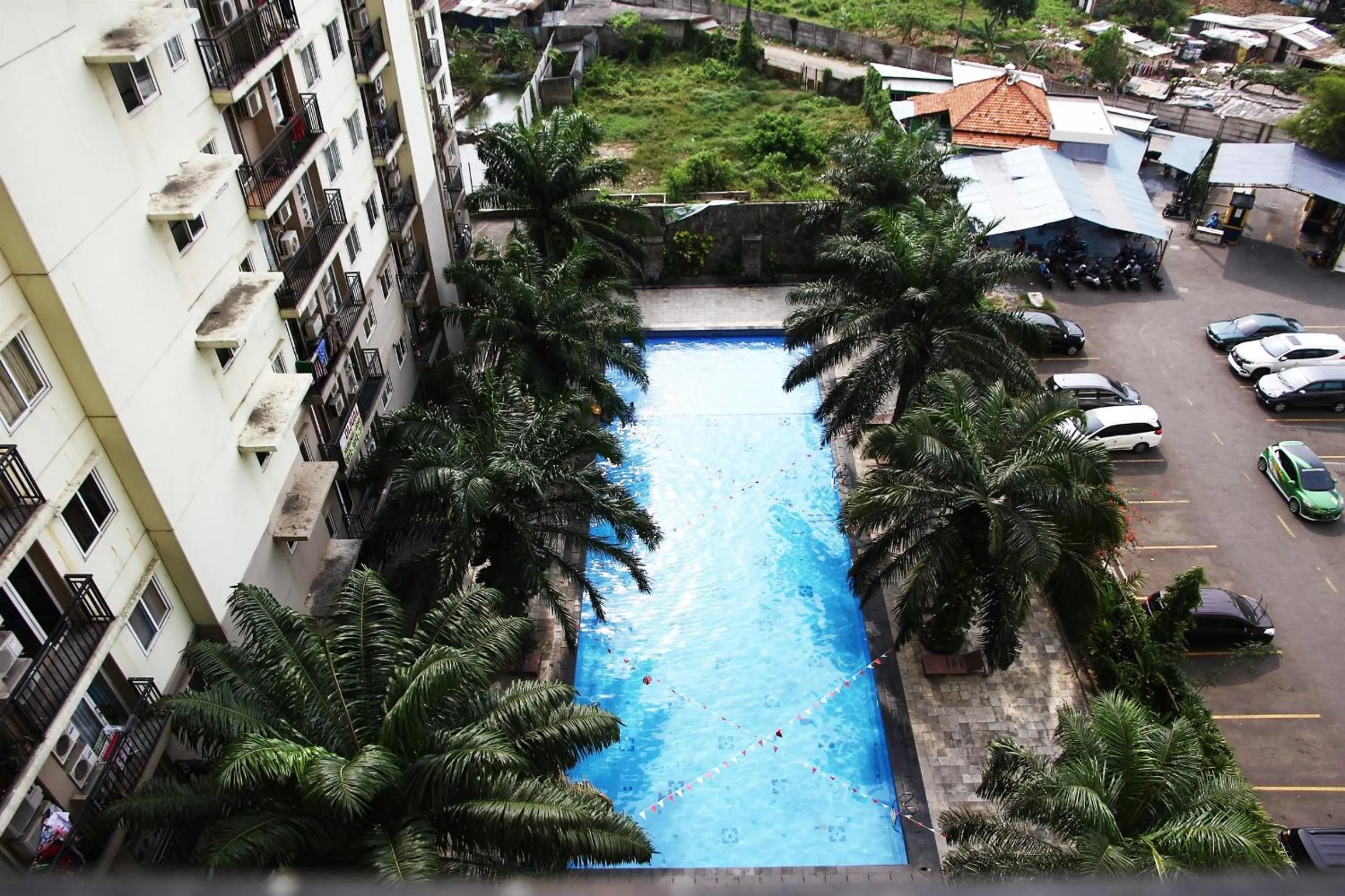 Property building in Pool View 2BR Mutiara Bekasi Apartment By Travelio