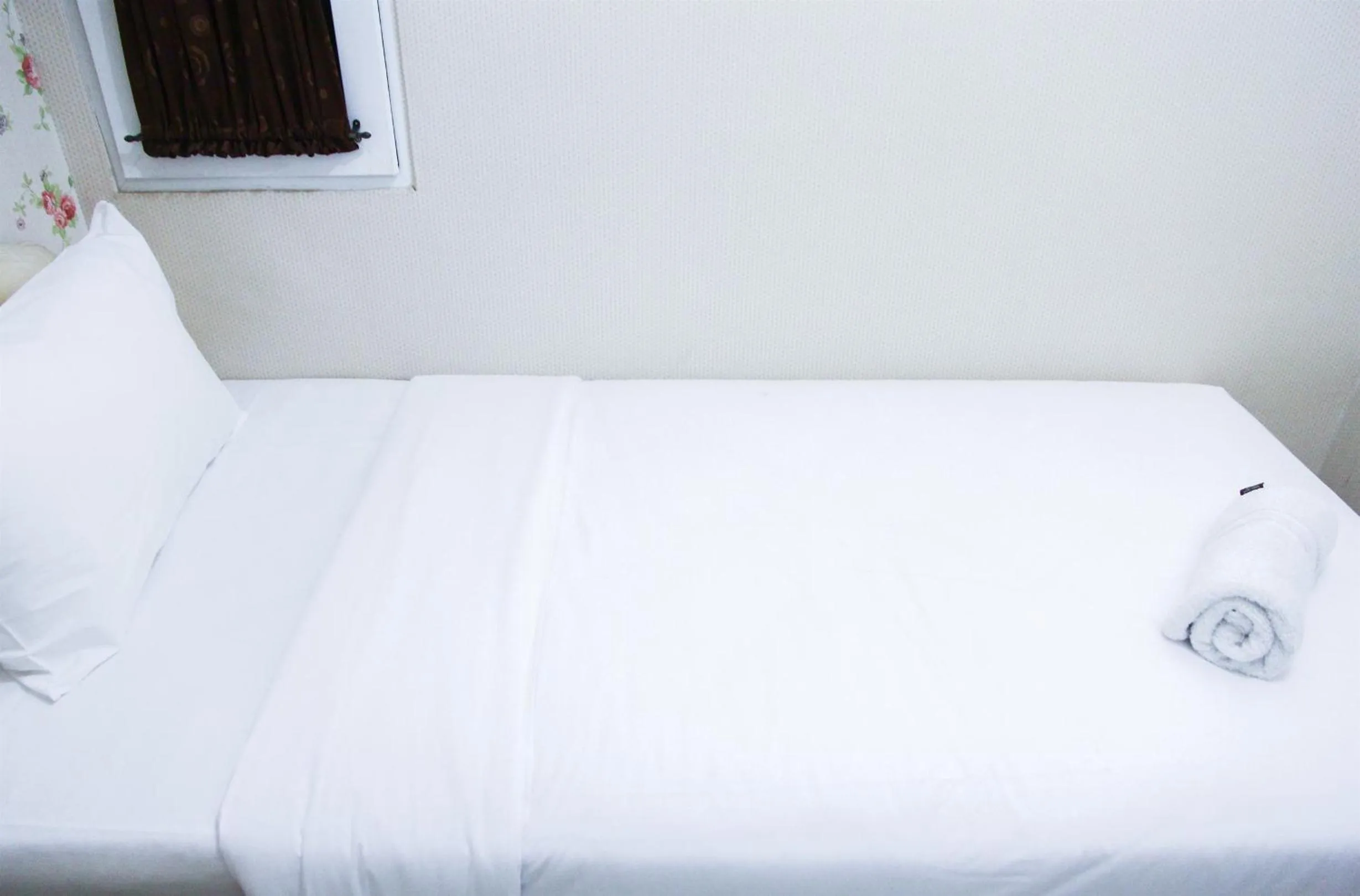 Bed in Pool View 2BR Mutiara Bekasi Apartment By Travelio