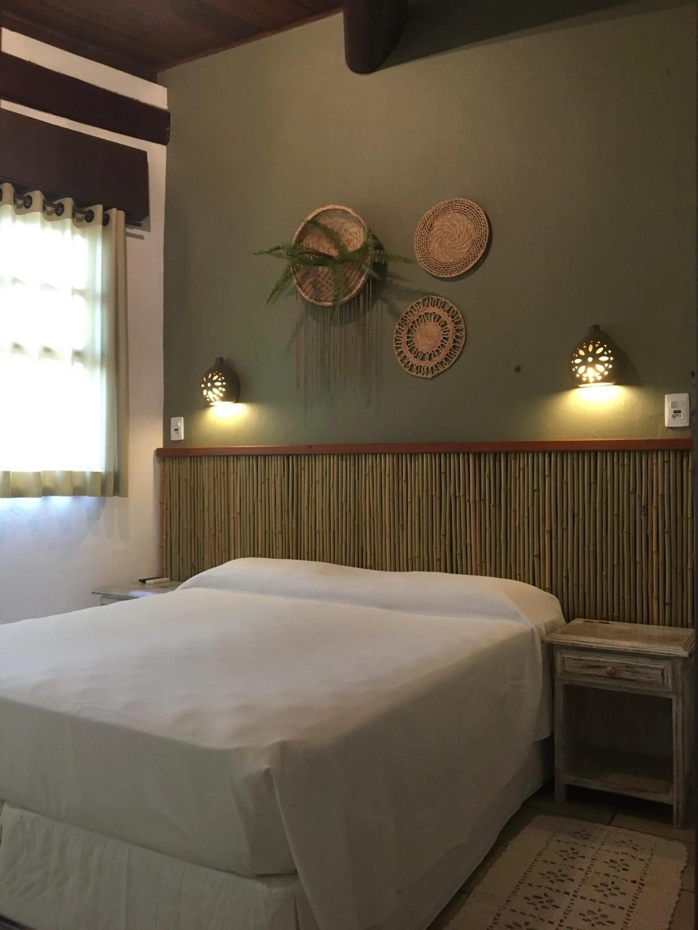 Bed in Pousada Aroeira