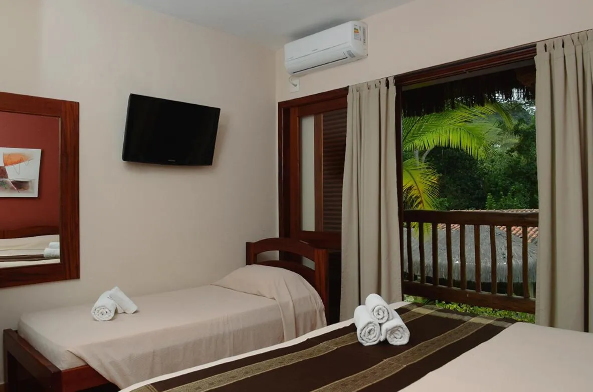 Bed in Pousada Bico Verde