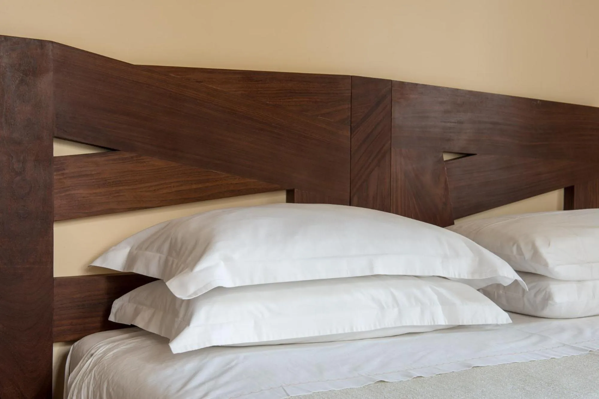 Bed in Palm Gallery Hotel