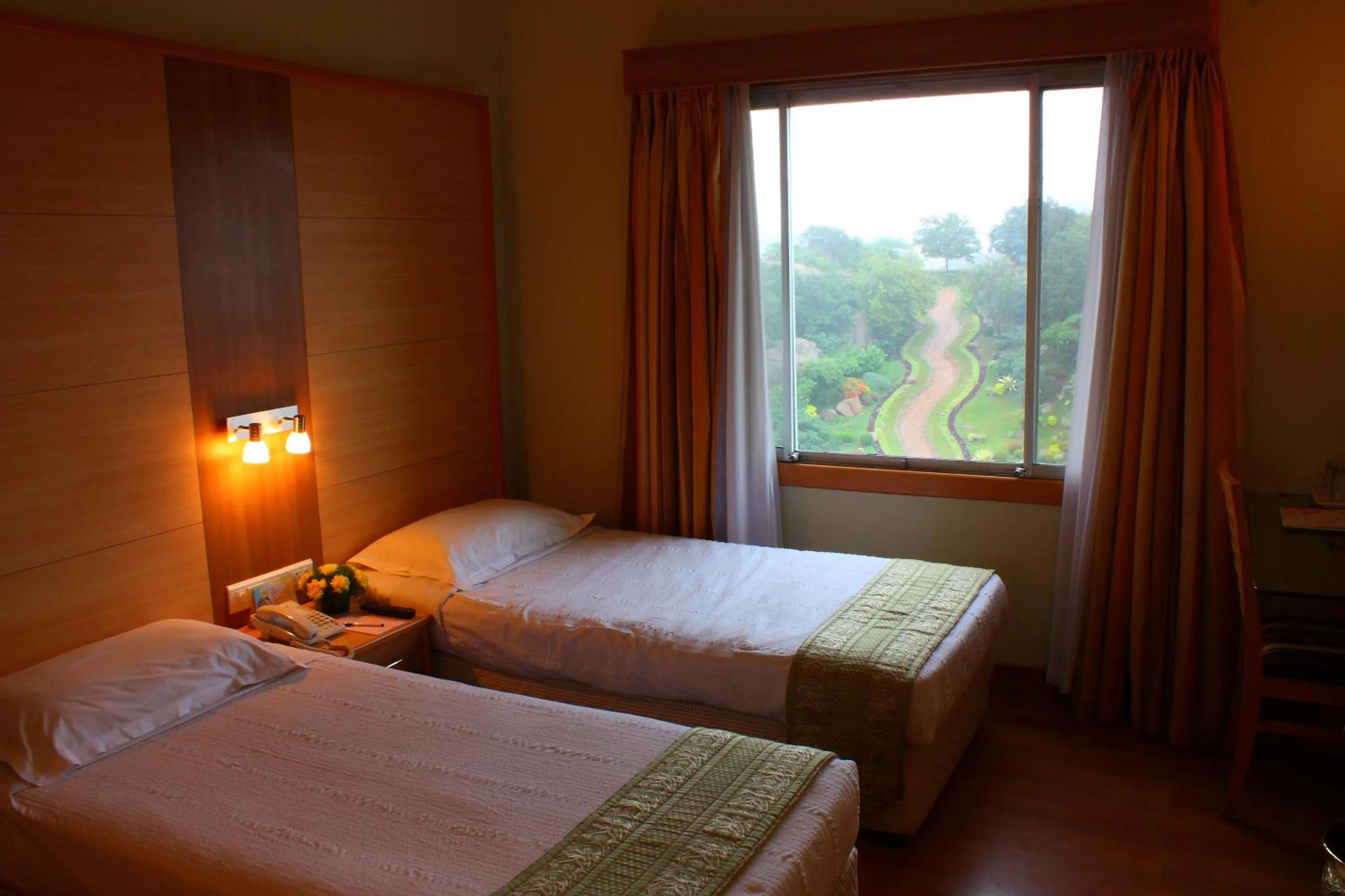Bedroom, Bed in Ramoji Film City- Tara Comfort Hotel