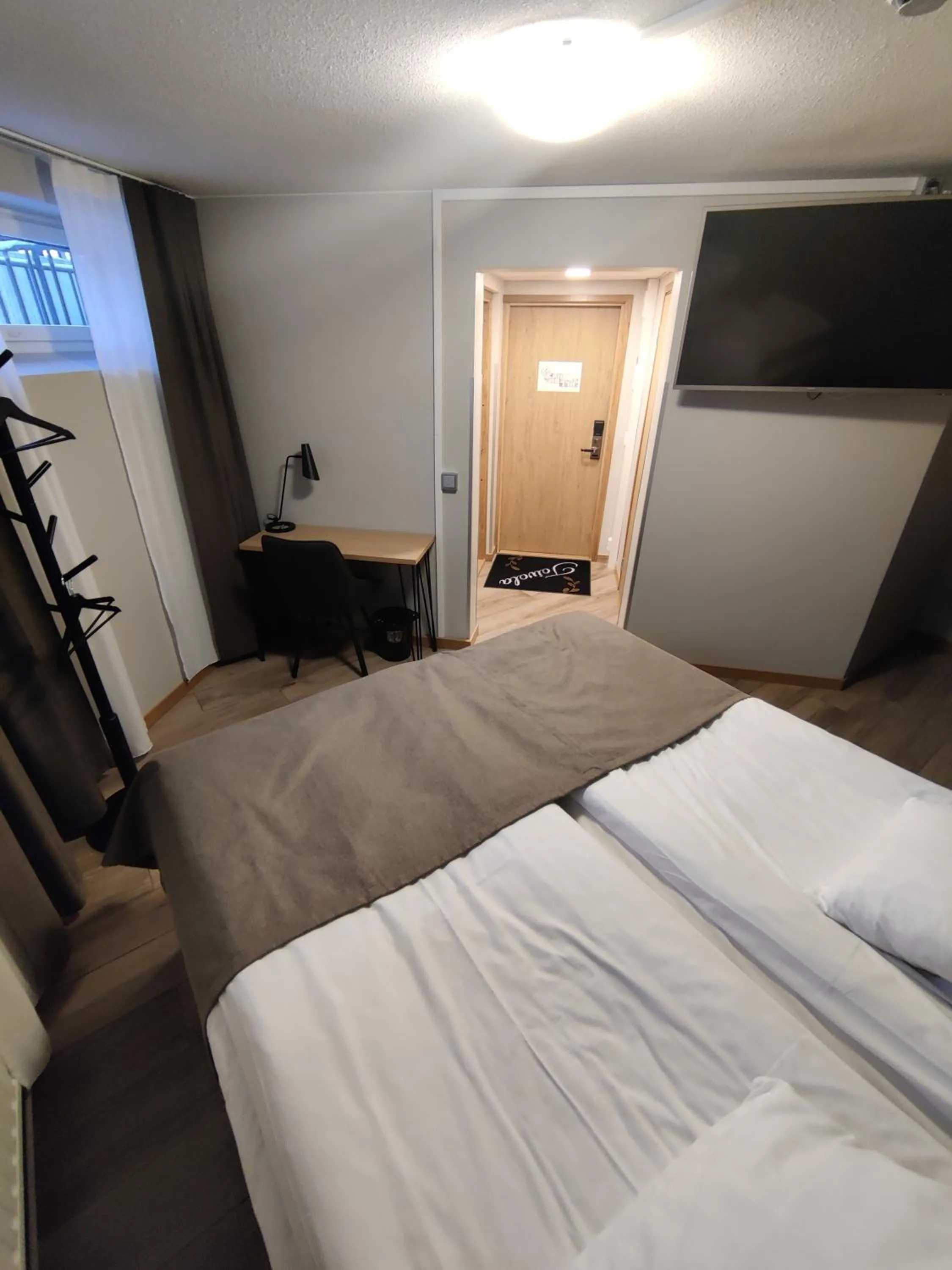 Photo of the whole room, Bed in Hotelli Toivola