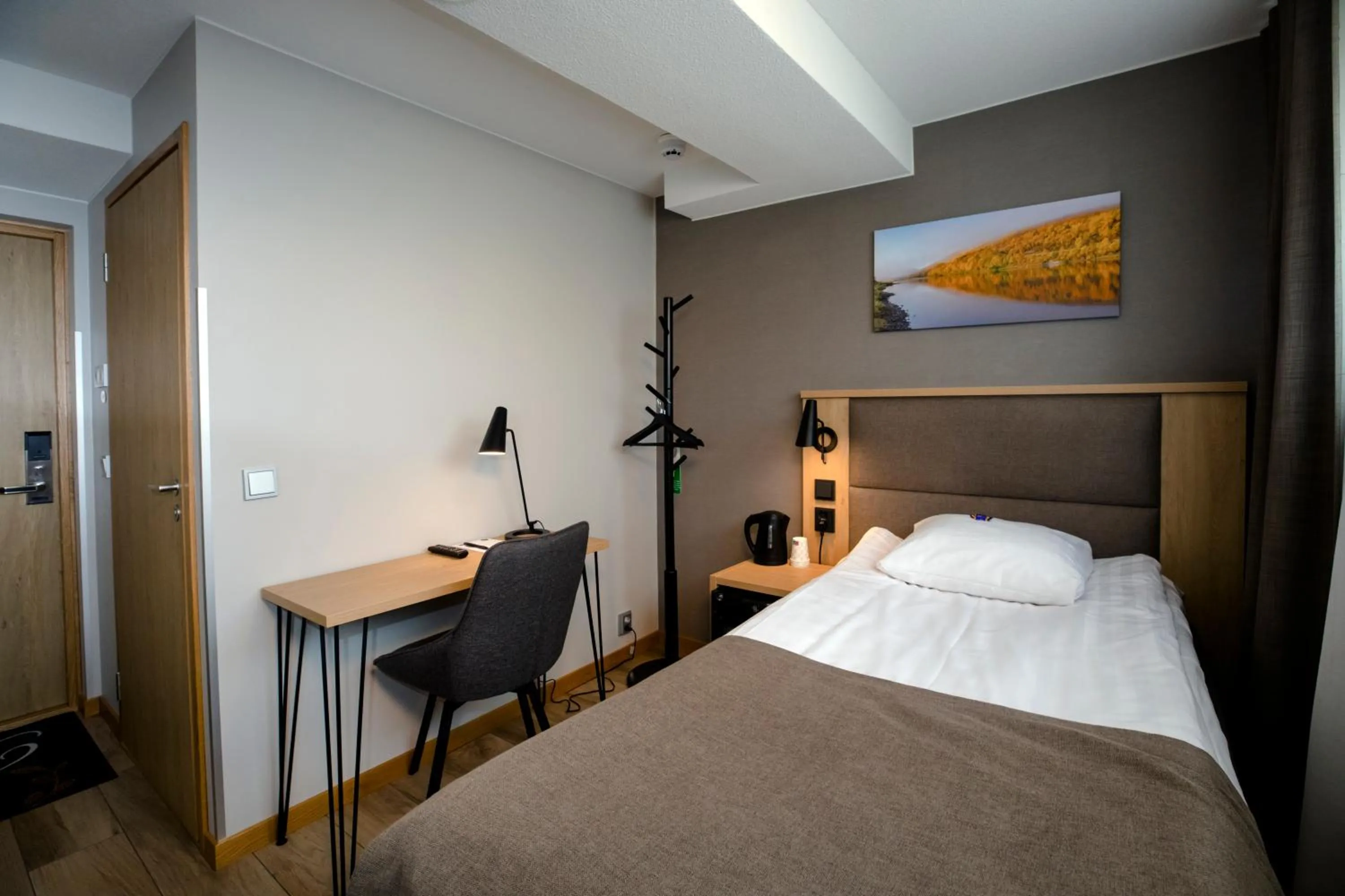 Photo of the whole room, Bed in Hotelli Toivola