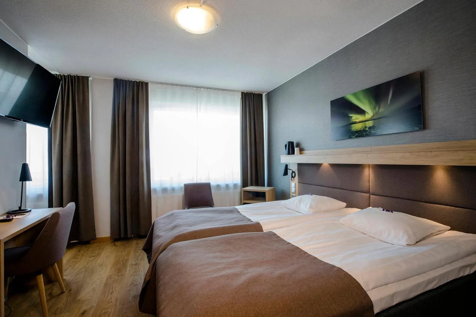 Photo of the whole room, Bed in Hotelli Toivola