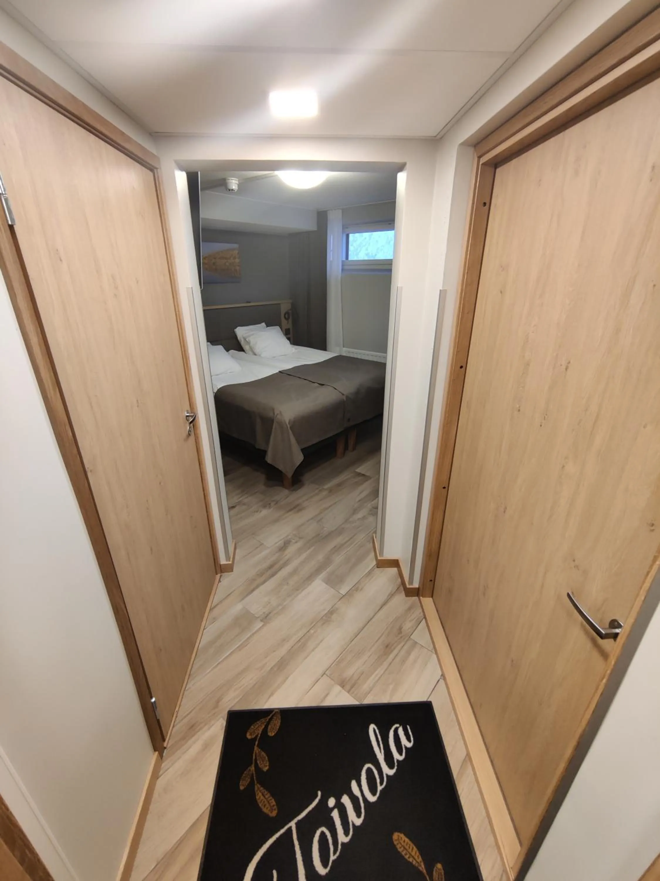 Photo of the whole room, Bed in Hotelli Toivola