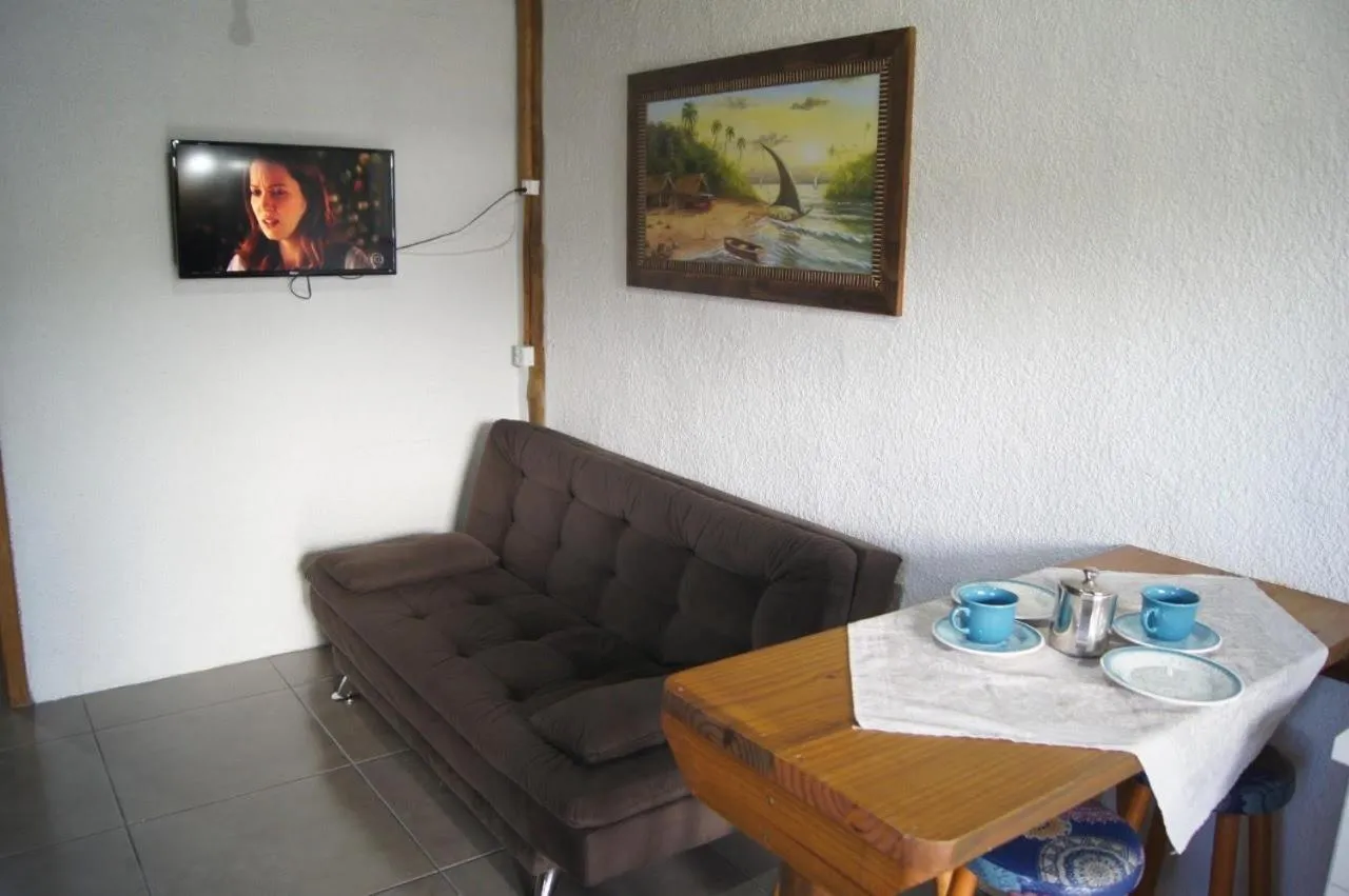 Living room in Mandala Chalés