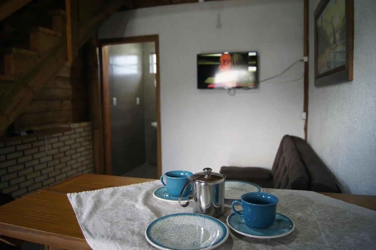 Kitchen or kitchenette in Mandala Chalés