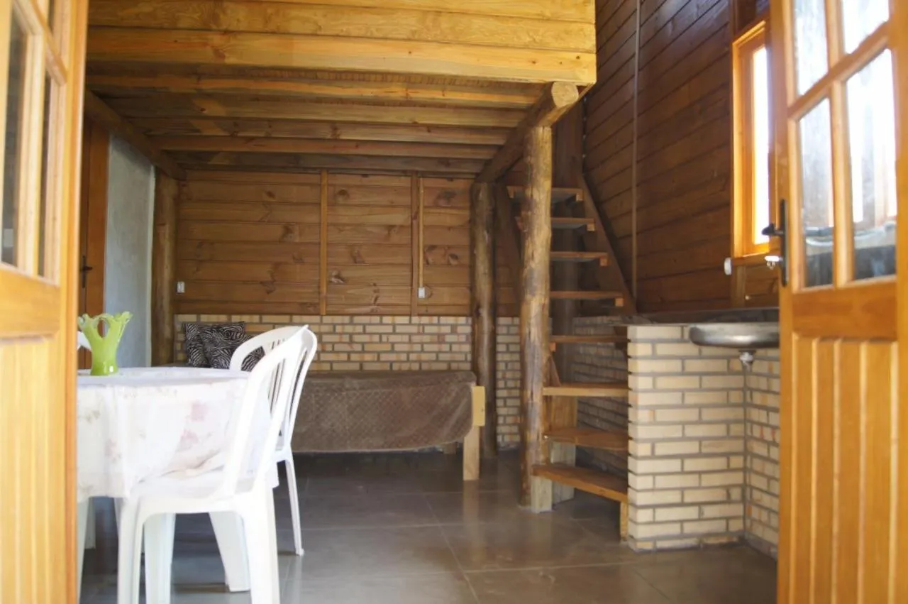 Living room in Mandala Chalés
