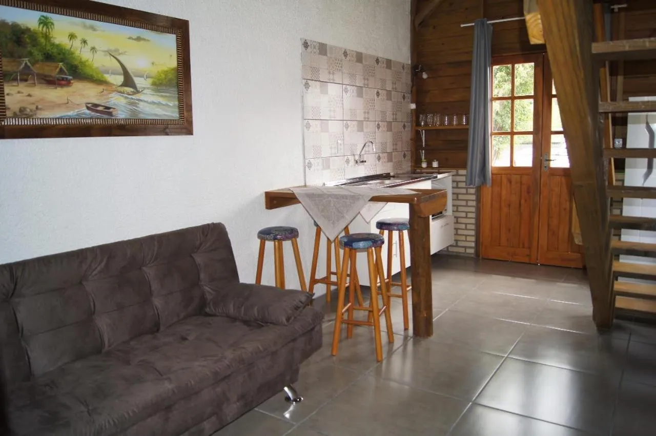 Living room in Mandala Chalés