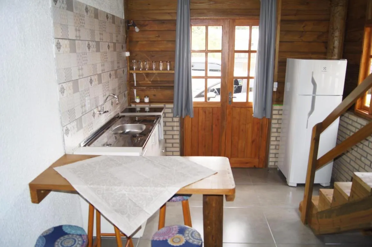 Kitchen or kitchenette in Mandala Chalés