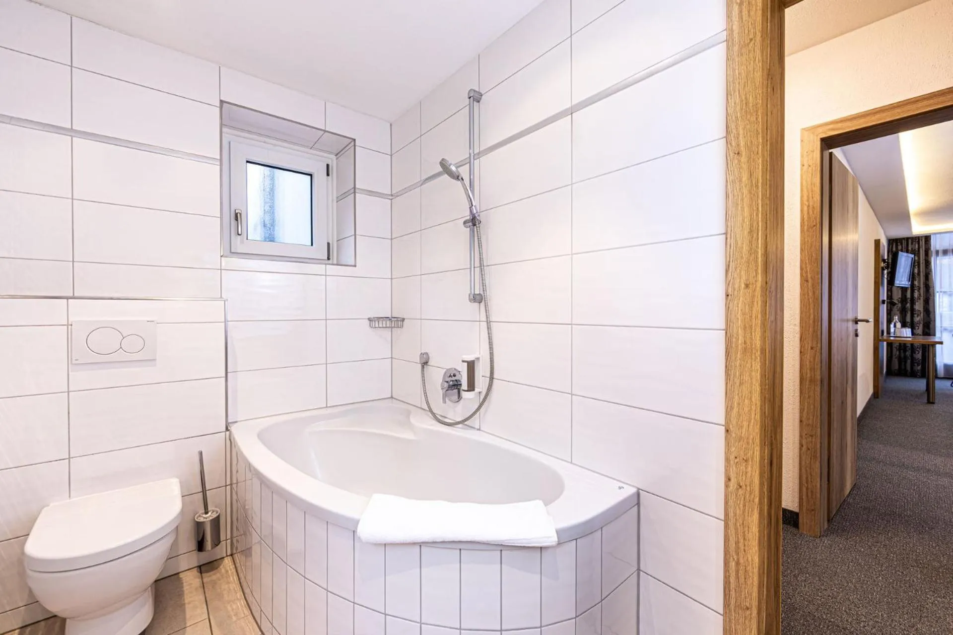 Bathroom in Hotel AlpinaRos