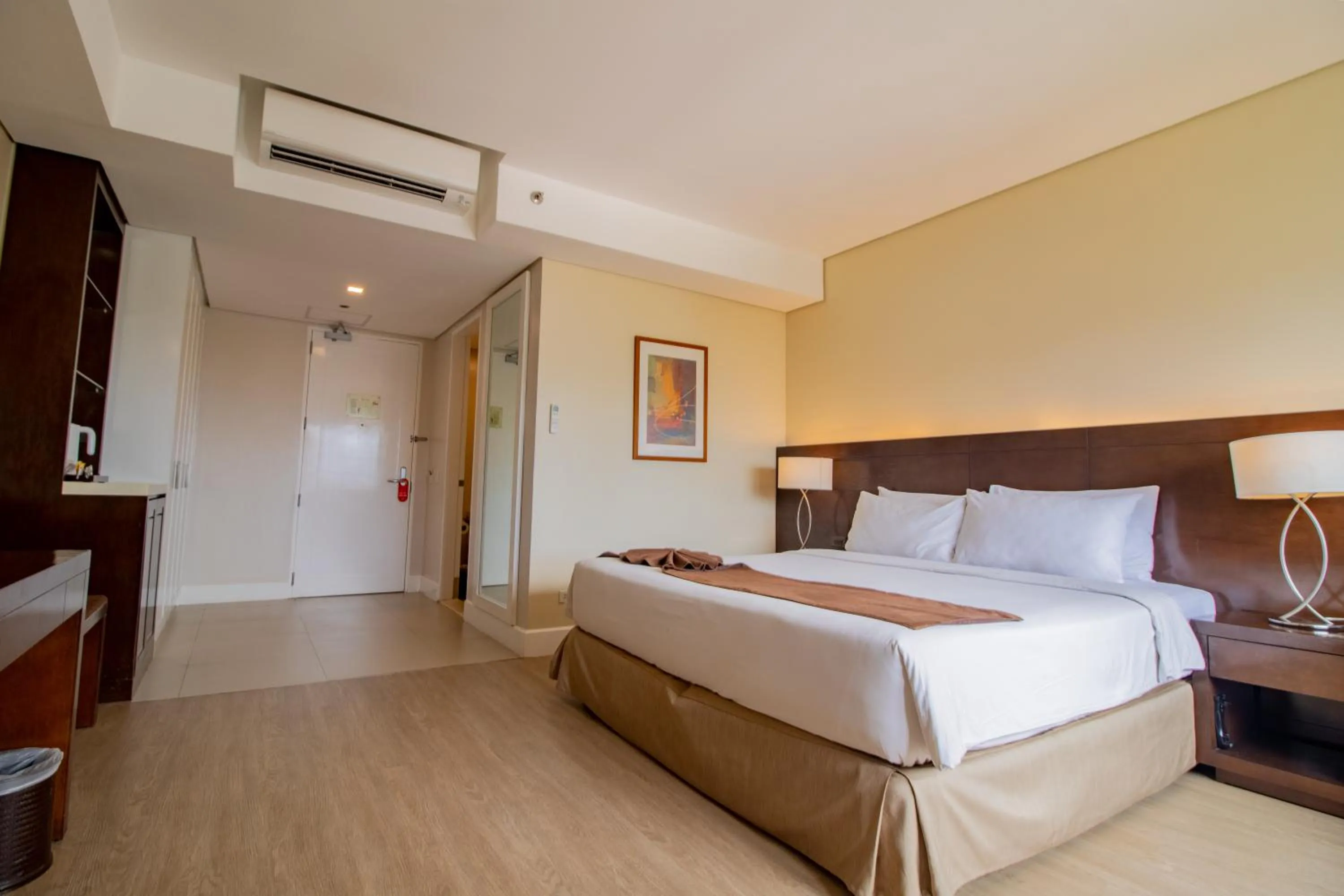 Photo of the whole room, Bed in Harolds Hotel Cebu