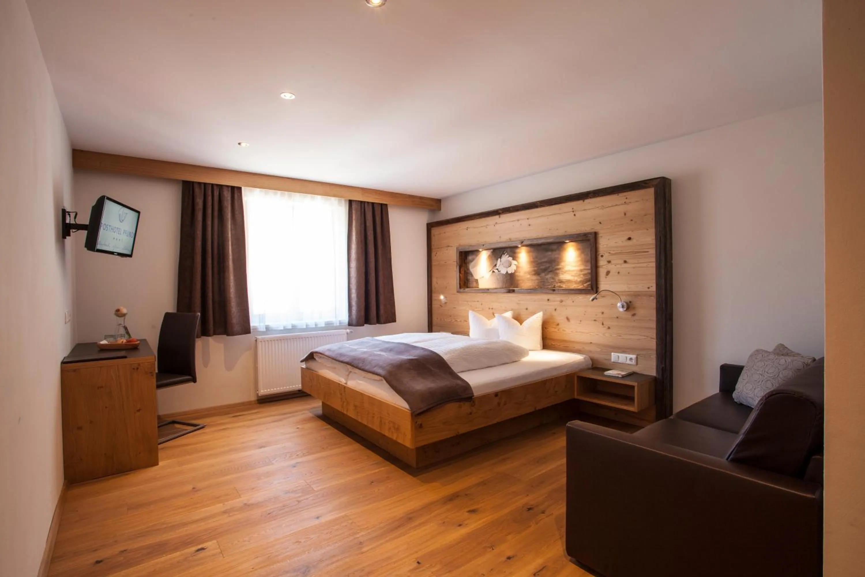 Photo of the whole room, Bed in Posthotel Pfunds