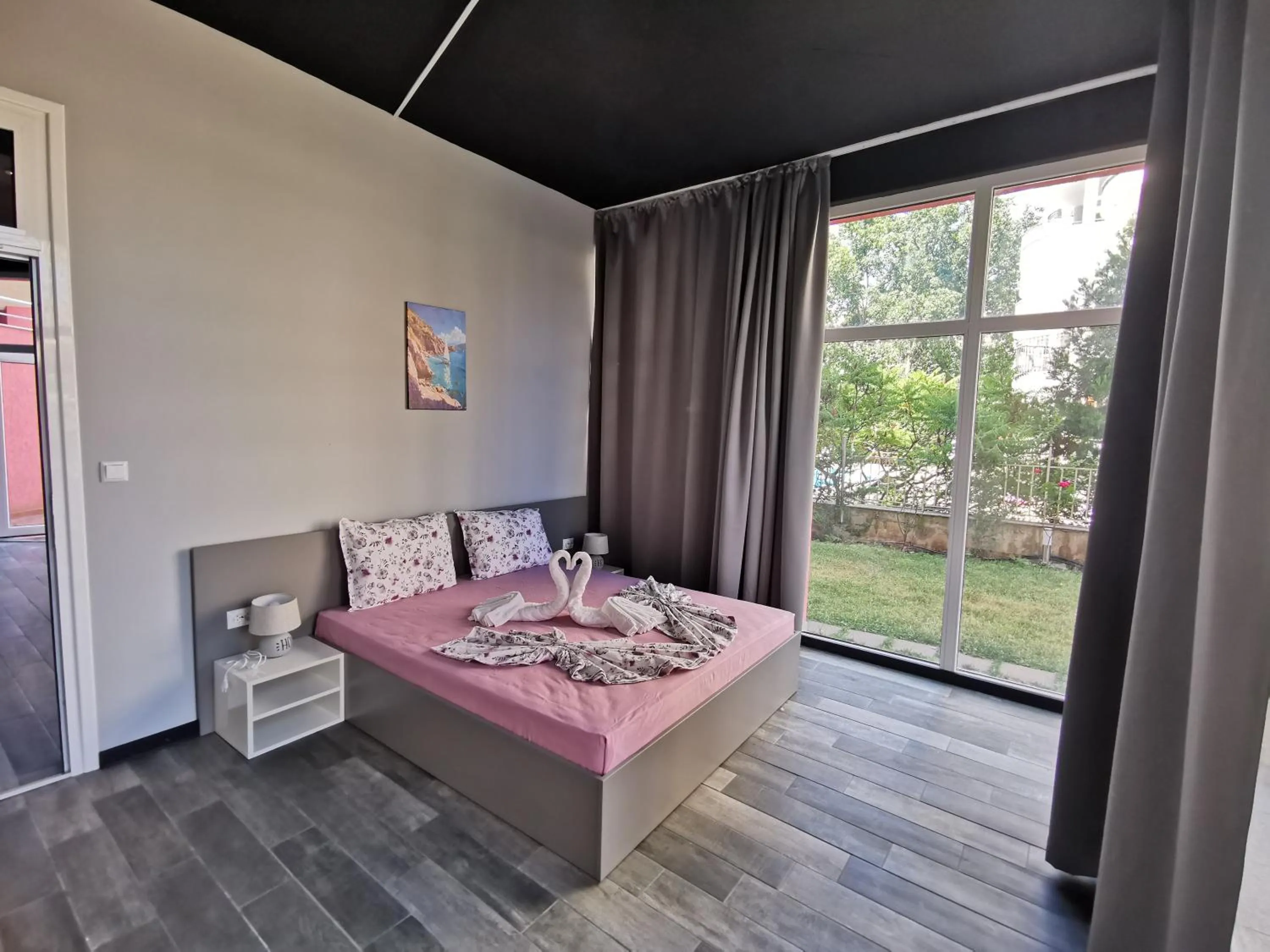 Bed in Rose Garden Omax Apartments