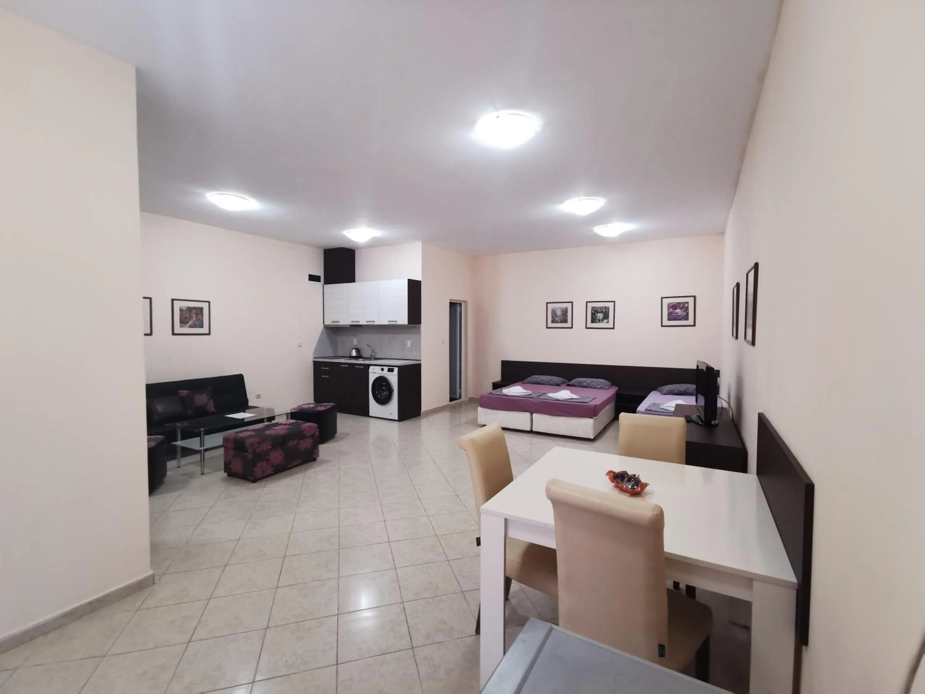 Bed in Rose Garden Omax Apartments