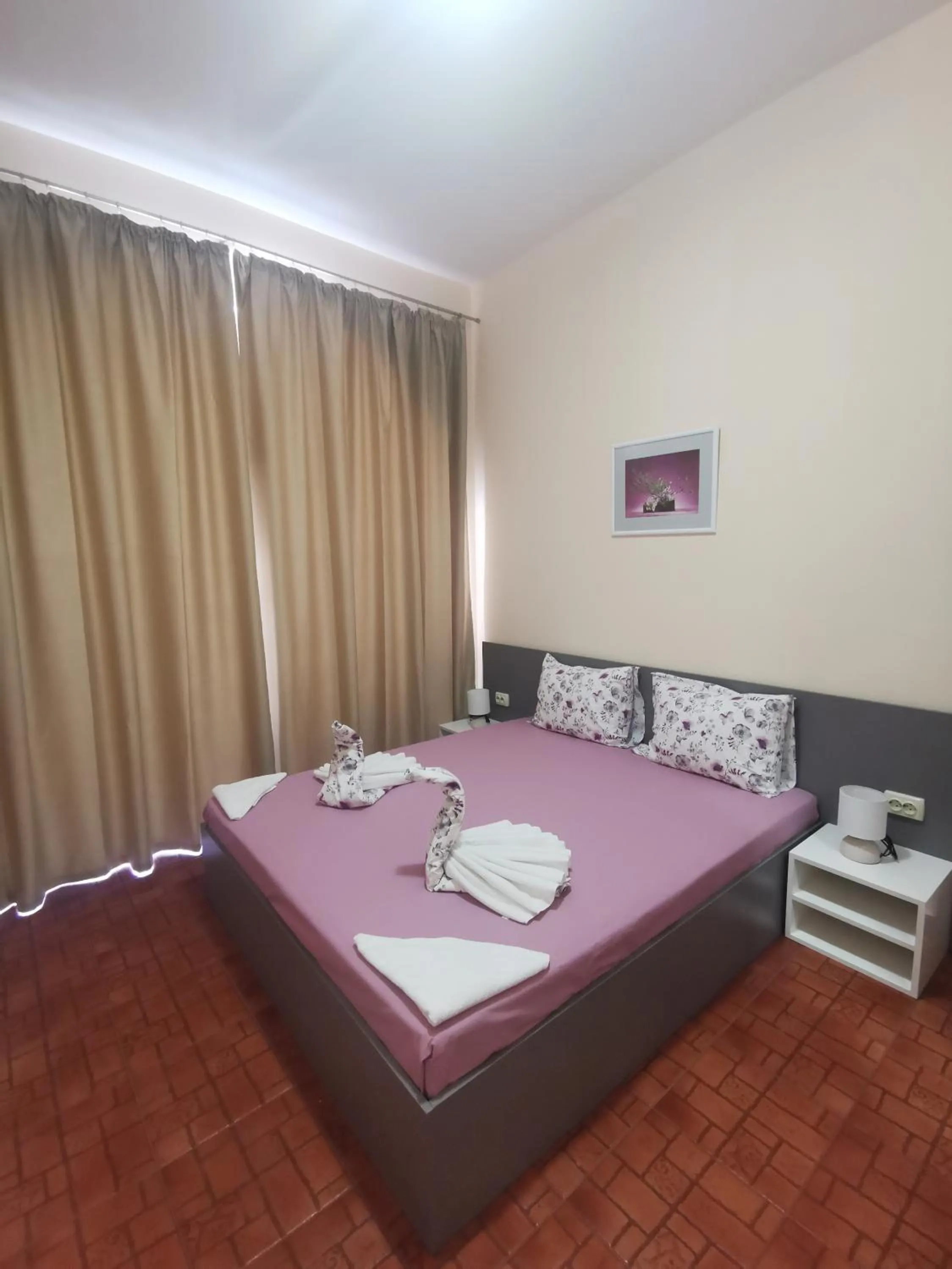 Bed in Rose Garden Omax Apartments