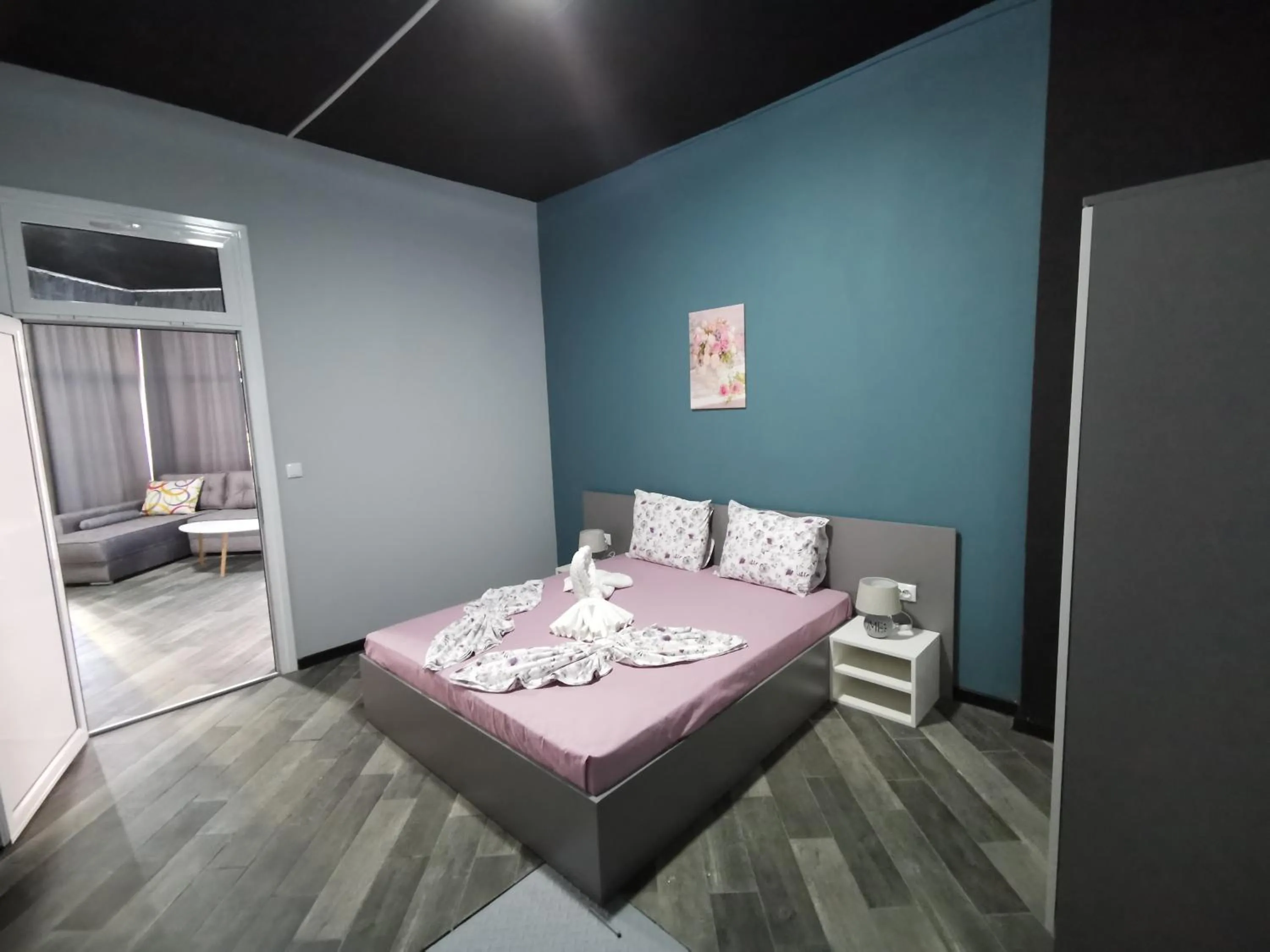 Bed in Rose Garden Omax Apartments