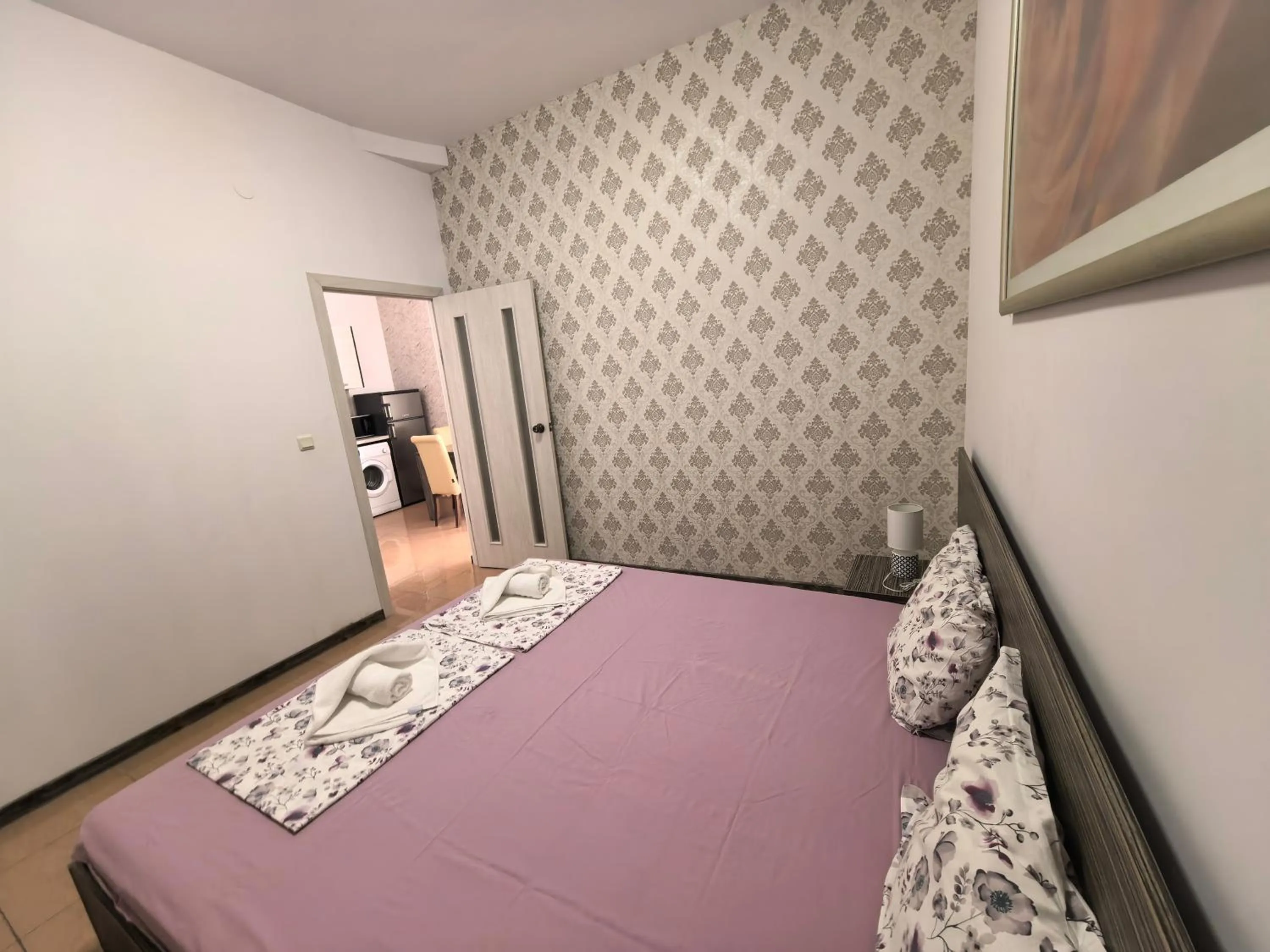 Bed in Rose Garden Omax Apartments