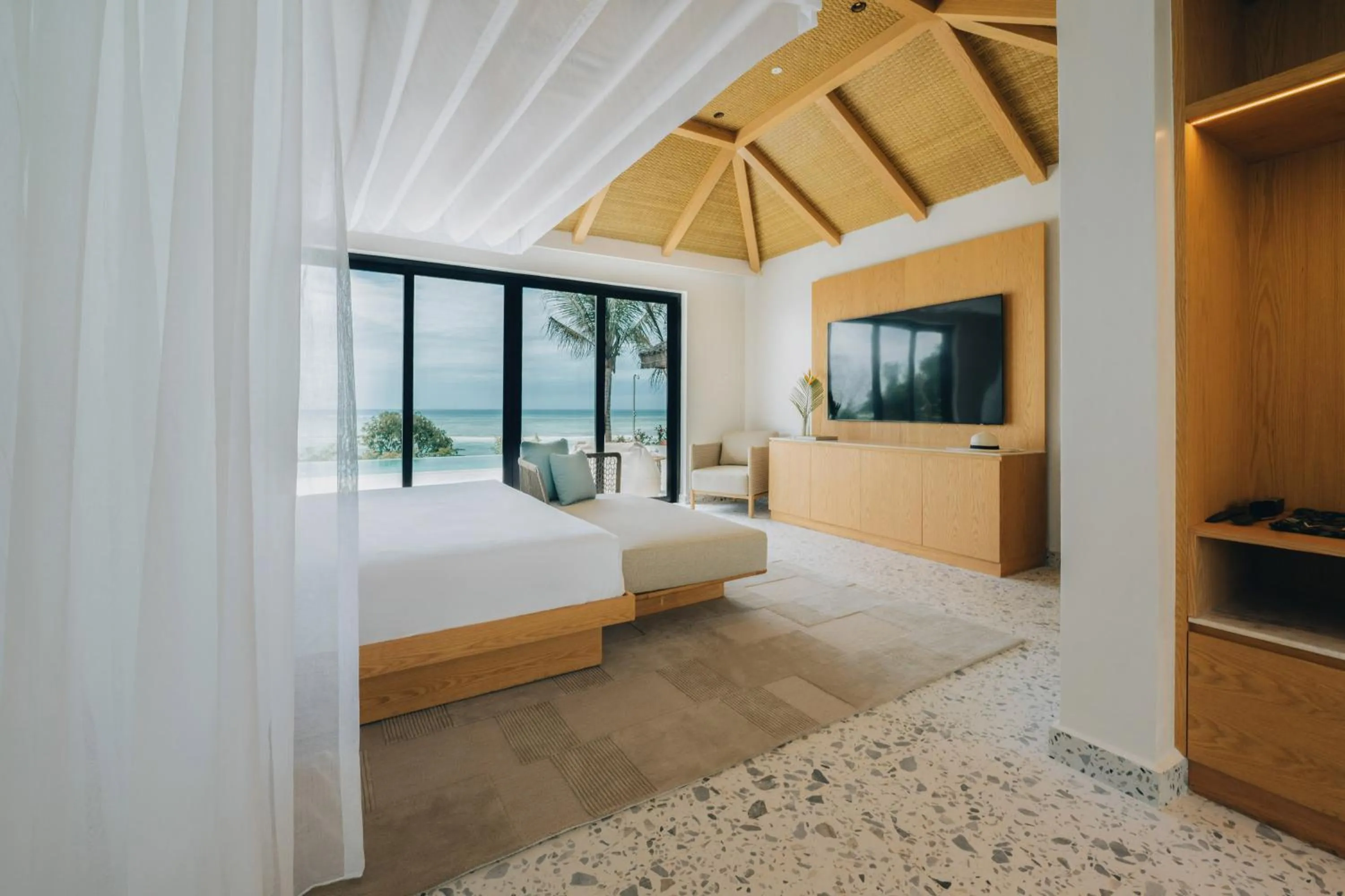 Communal lounge/ TV room, Bed in Melia Zanzibar