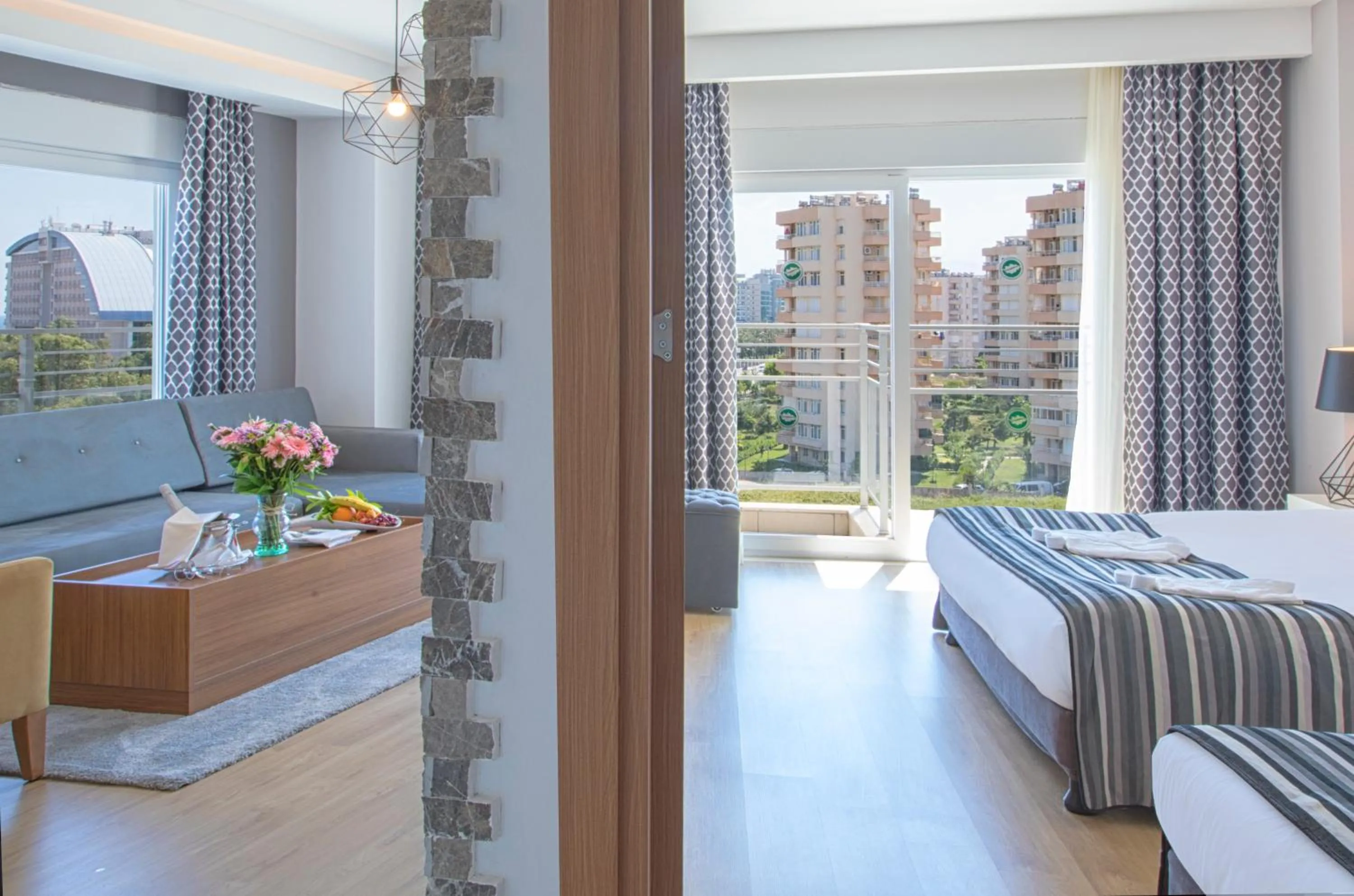 Living room, Bed in Greenwood Suites Resort