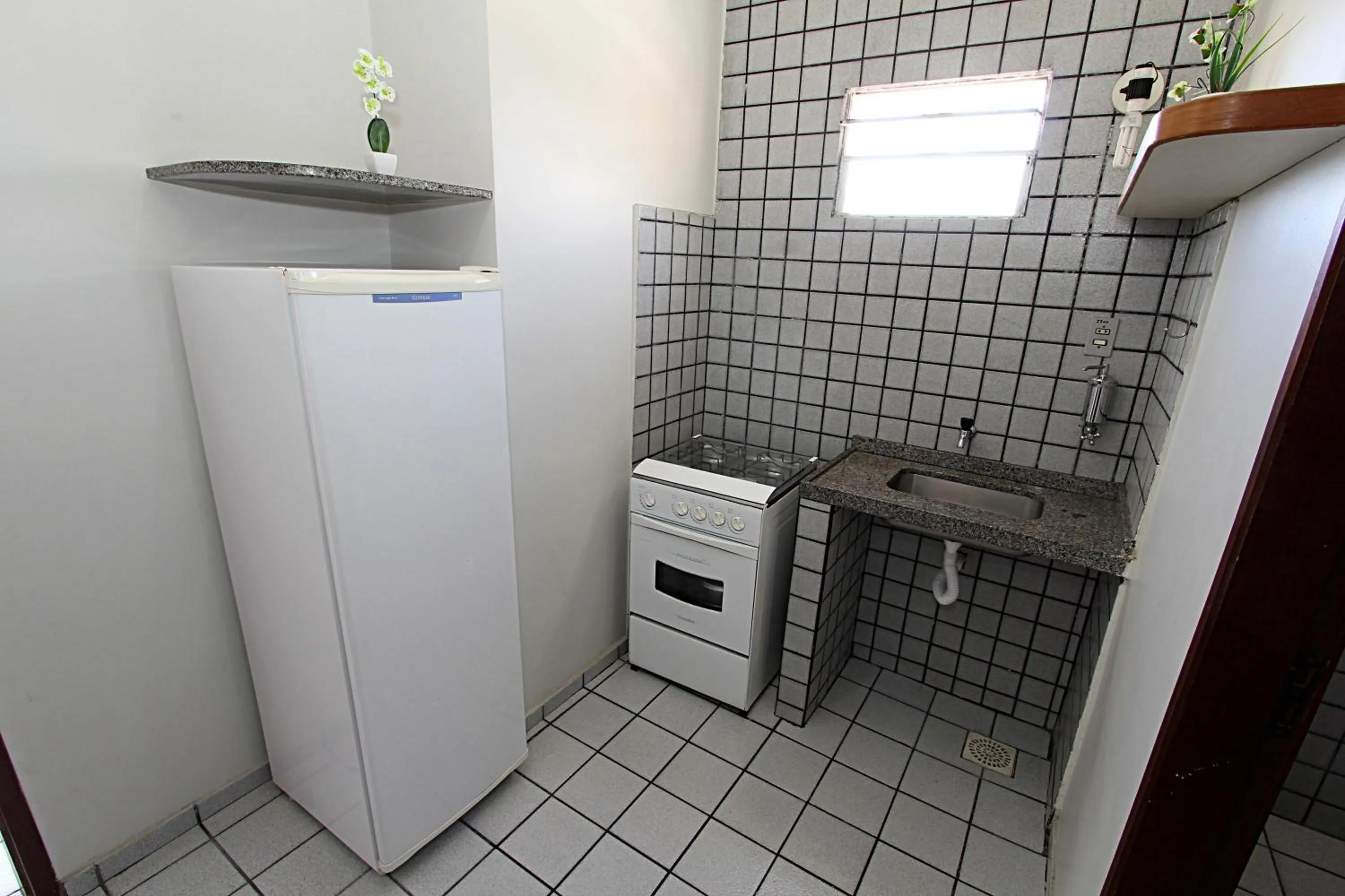 Kitchen or kitchenette in Flat Pousada da Praia