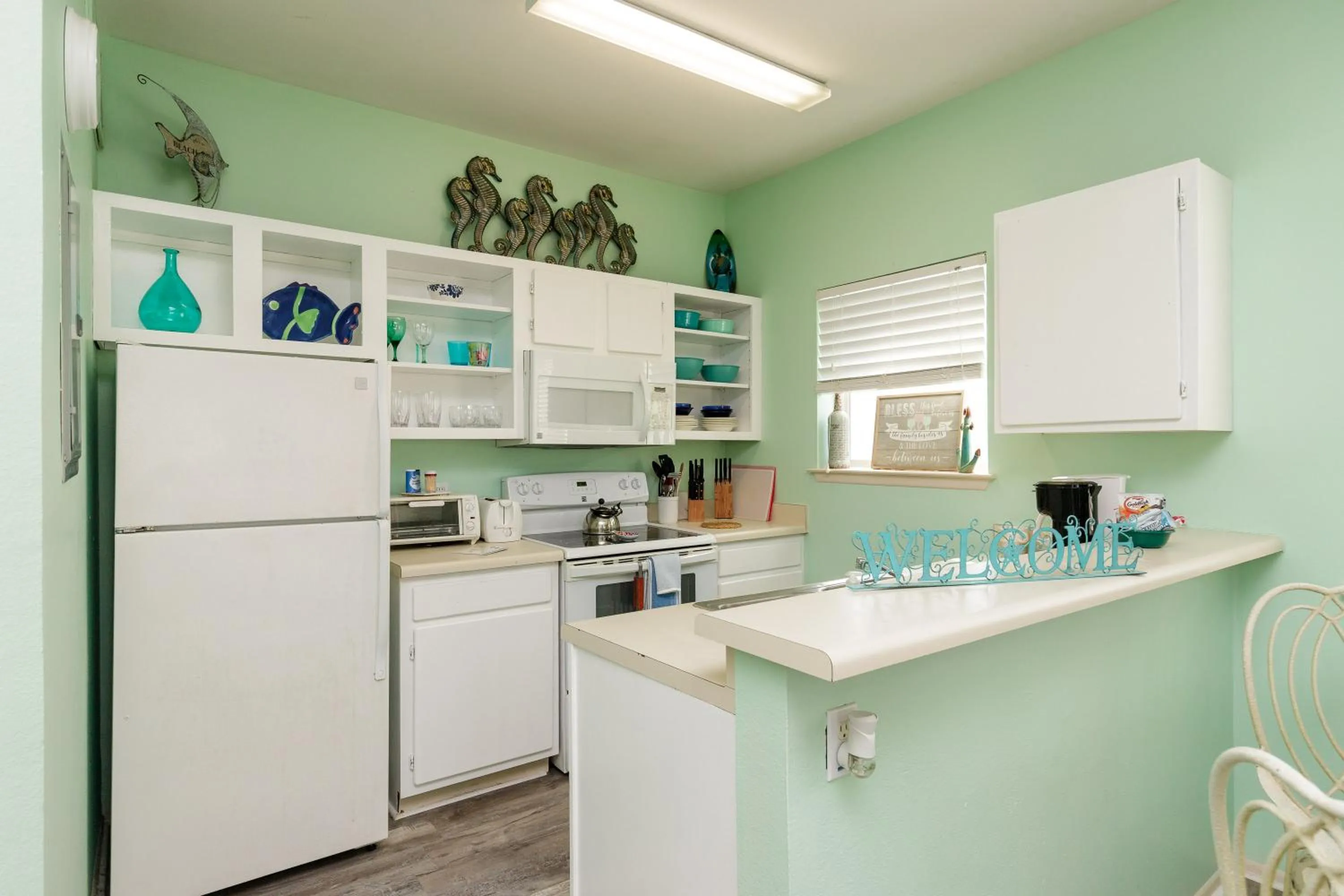 kitchen in Charming family condo - walking distance to beach by Mustang Island, Sleeps Four, 2025 Traveler Award