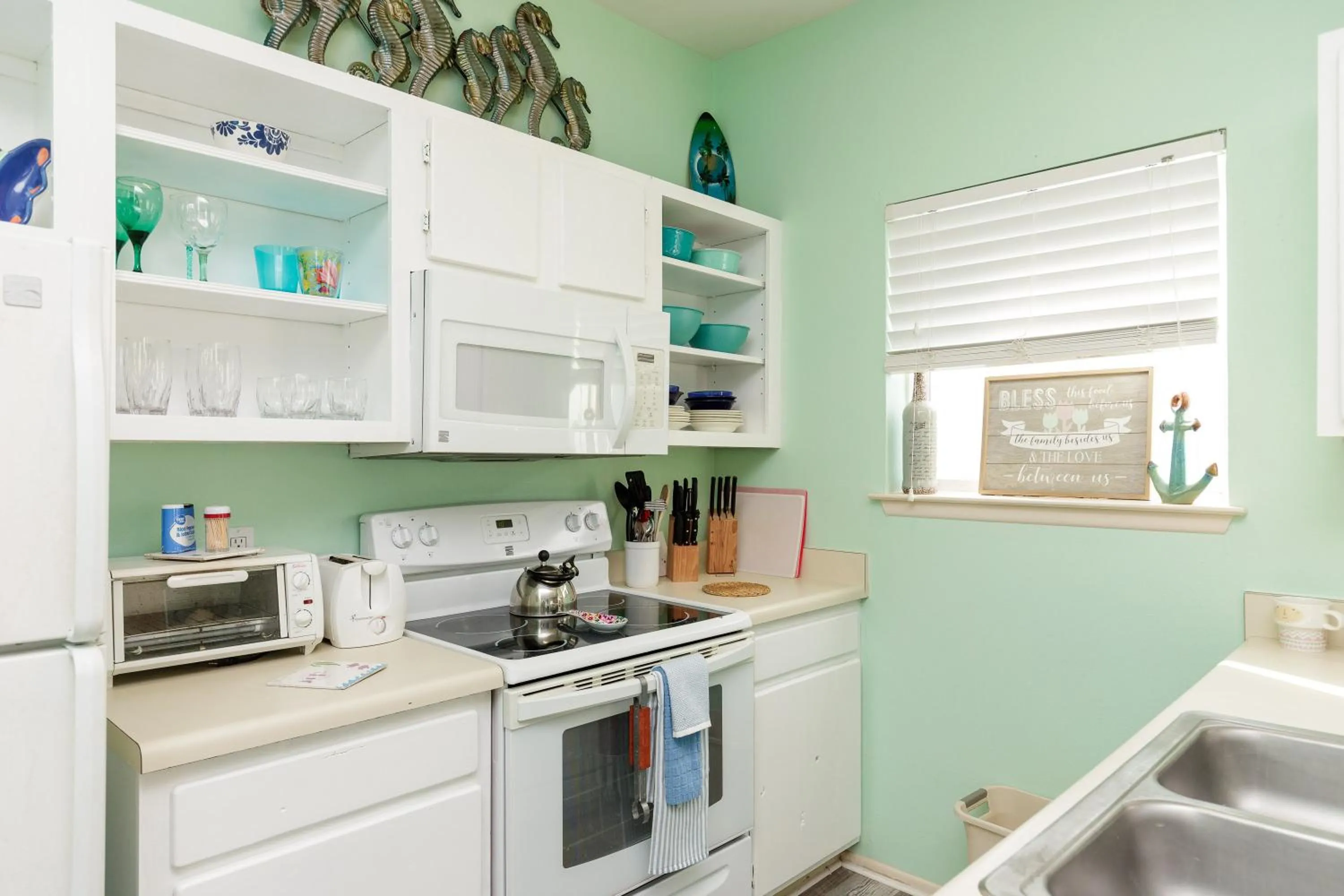 kitchen in Charming family condo - walking distance to beach by Mustang Island, Sleeps Four, 2025 Traveler Award