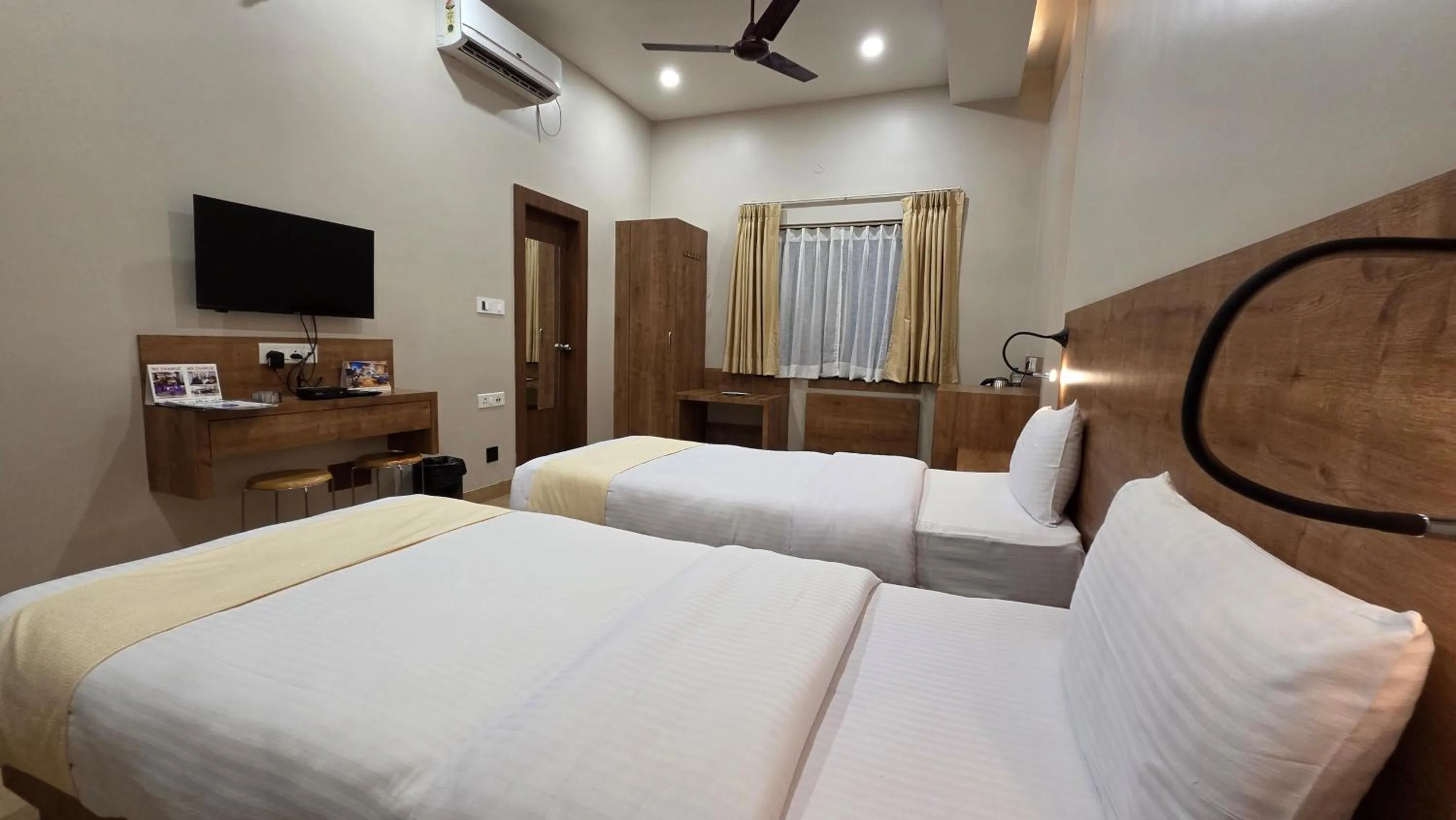 Photo of the whole room, Bed in Hotel Gulmohar Grand