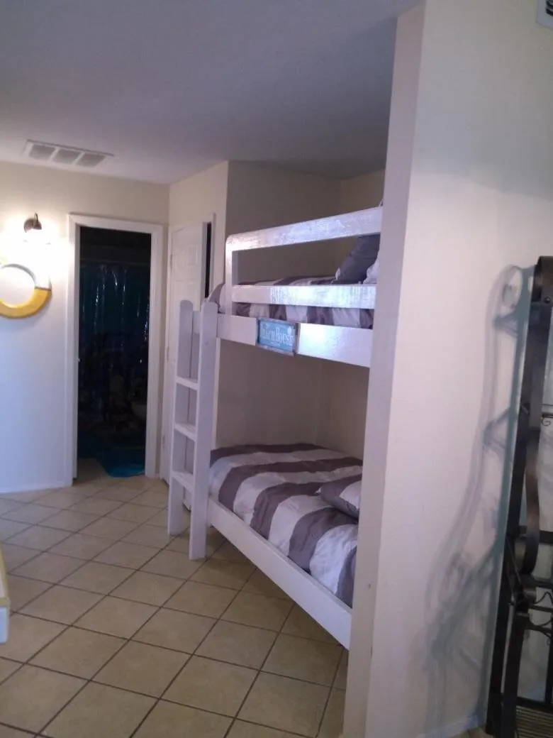 Photo of the whole room, Bed in Charming SPI family condo - walking distance to the beach, Sleeps 6, Third Floor, 2025 Traveler Award