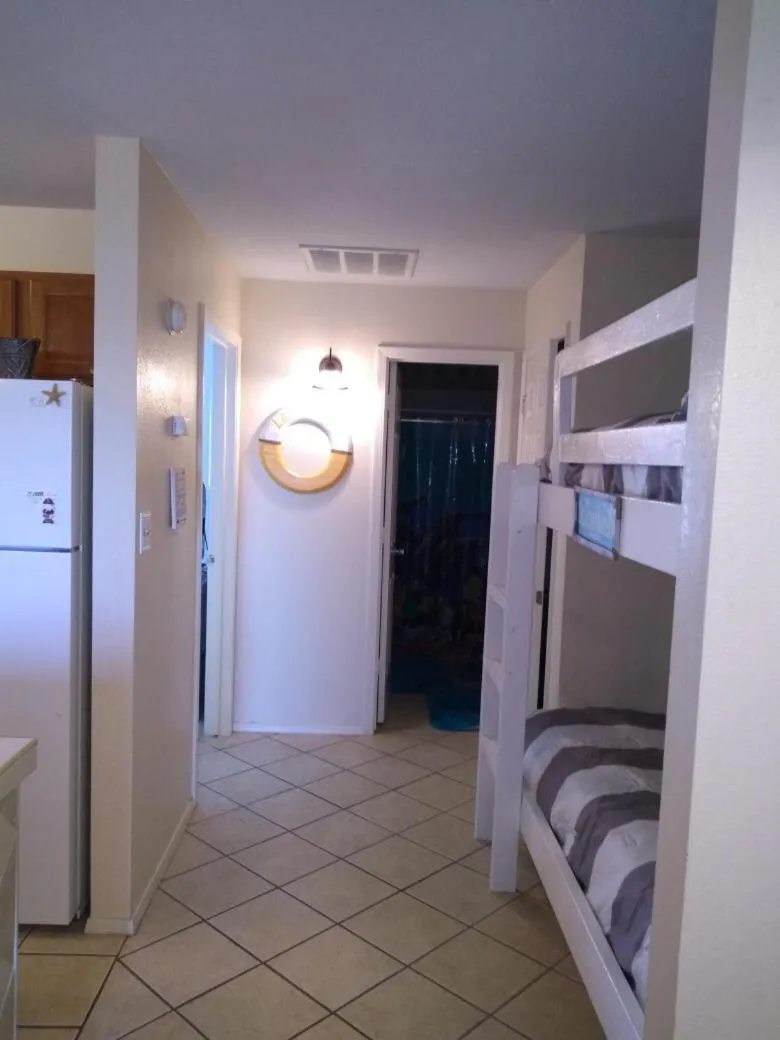 bunk bed, Bed in Charming SPI family condo - walking distance to the beach, Sleeps 6, Third Floor, 2025 Traveler Award