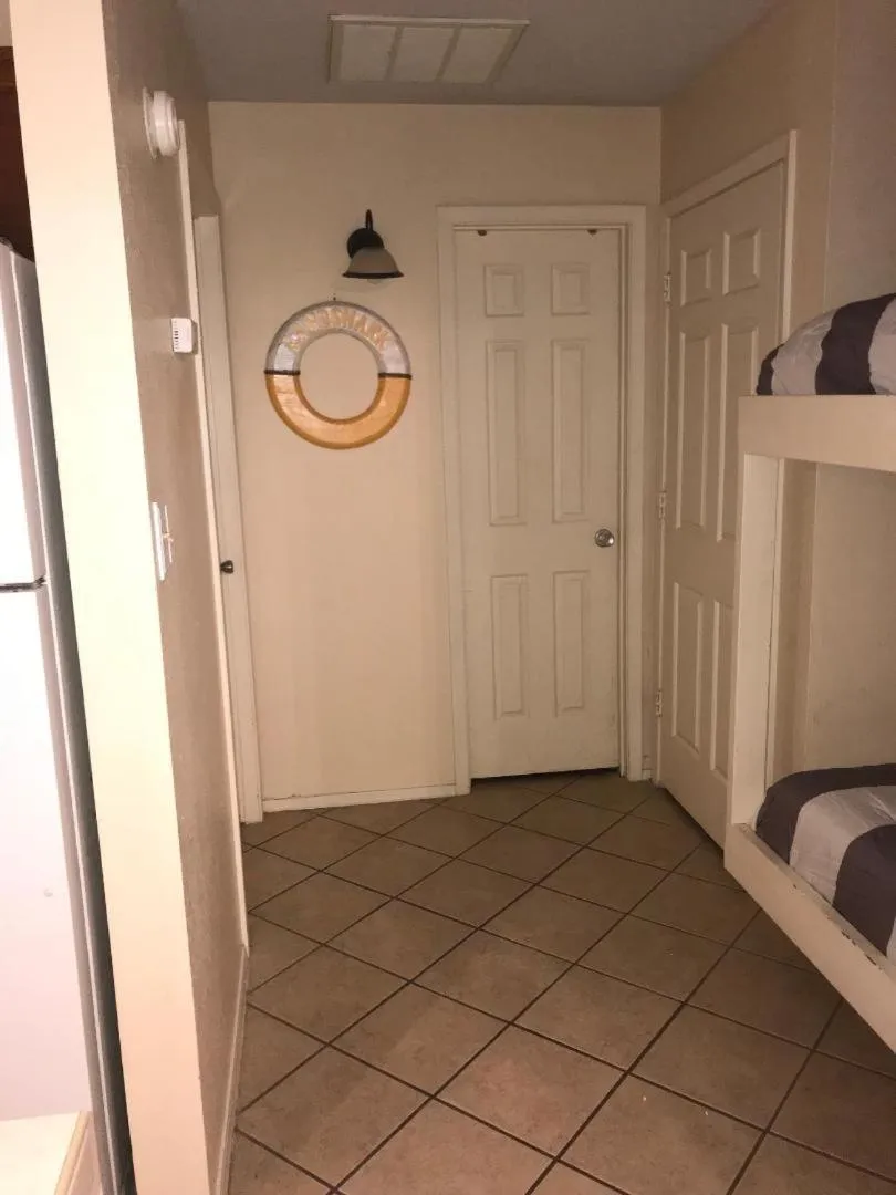 Photo of the whole room, Bed in Charming SPI family condo - walking distance to the beach, Sleeps 6, Third Floor, 2025 Traveler Award