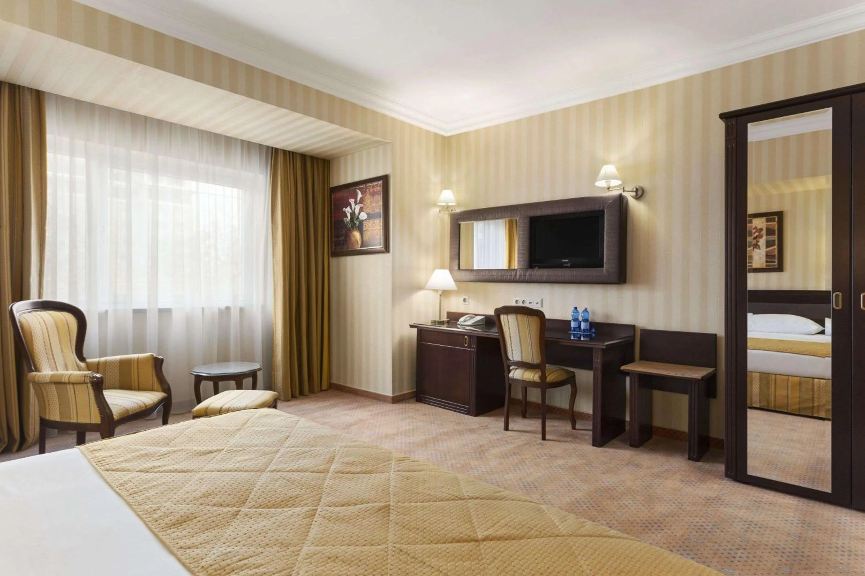Photo of the whole room, Bed in Ramada Hotel & Suites by Wyndham Bucharest North