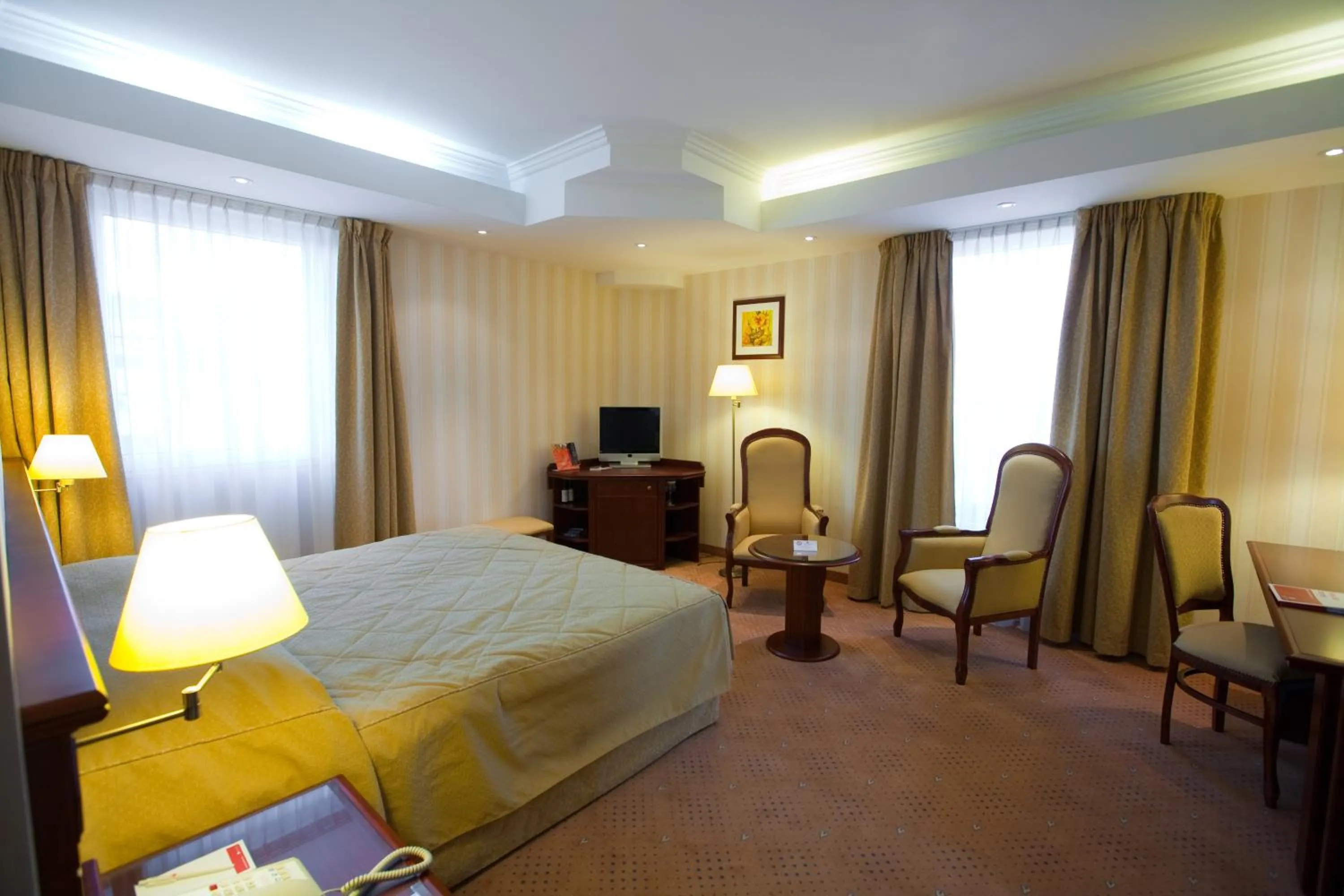 Photo of the whole room, Bed in Ramada Hotel & Suites by Wyndham Bucharest North