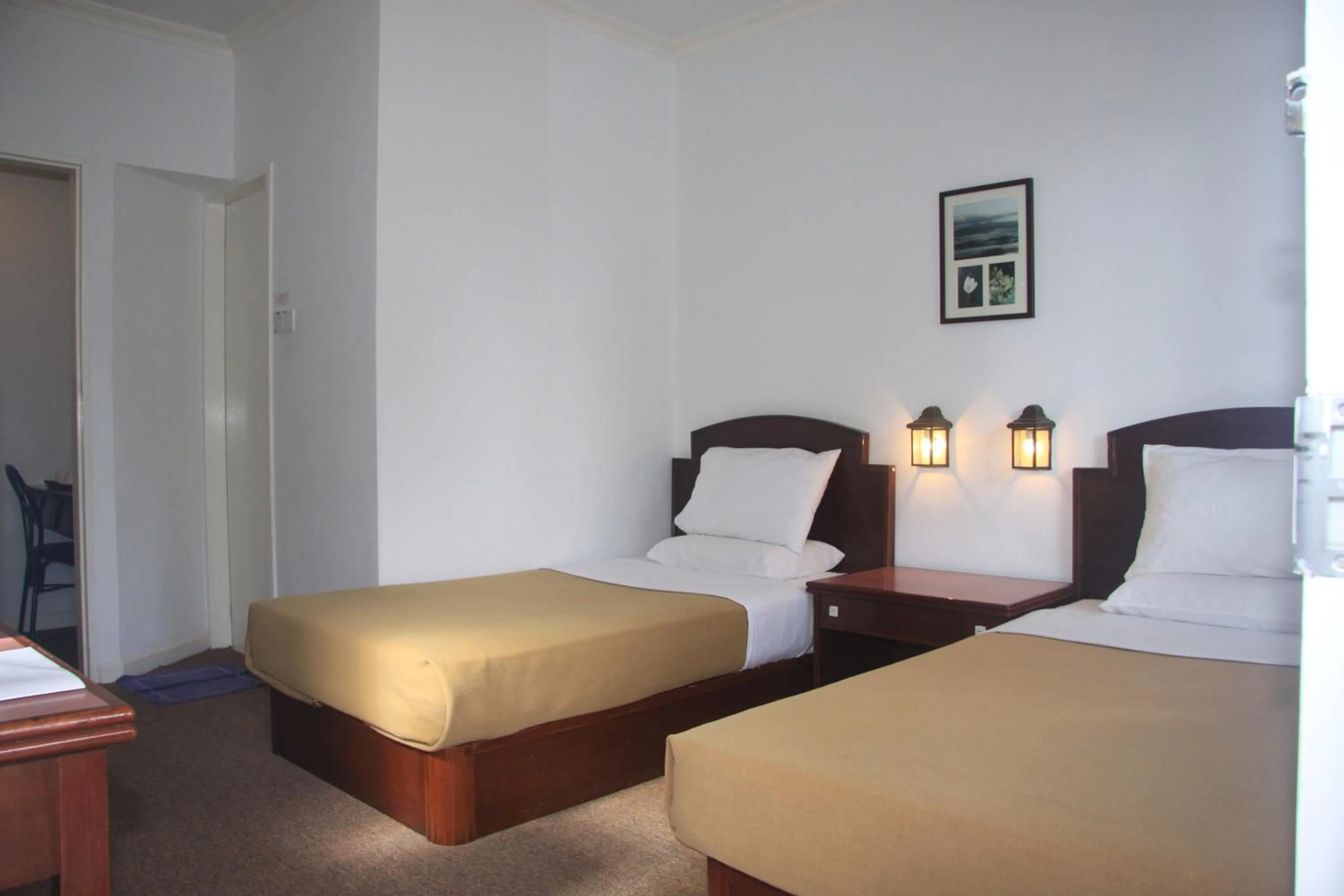 Bed in Kinabalu Pine Resort