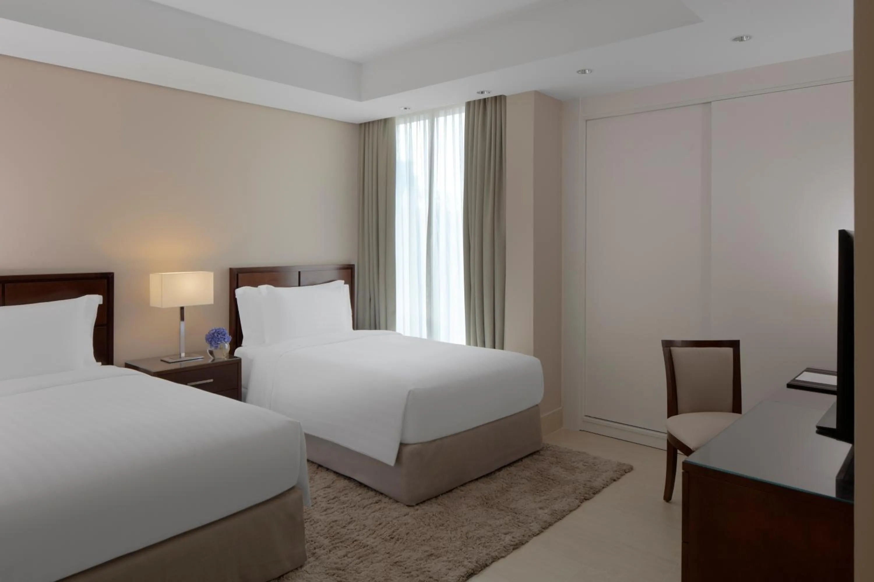 Bed in Dusit Doha Hotel