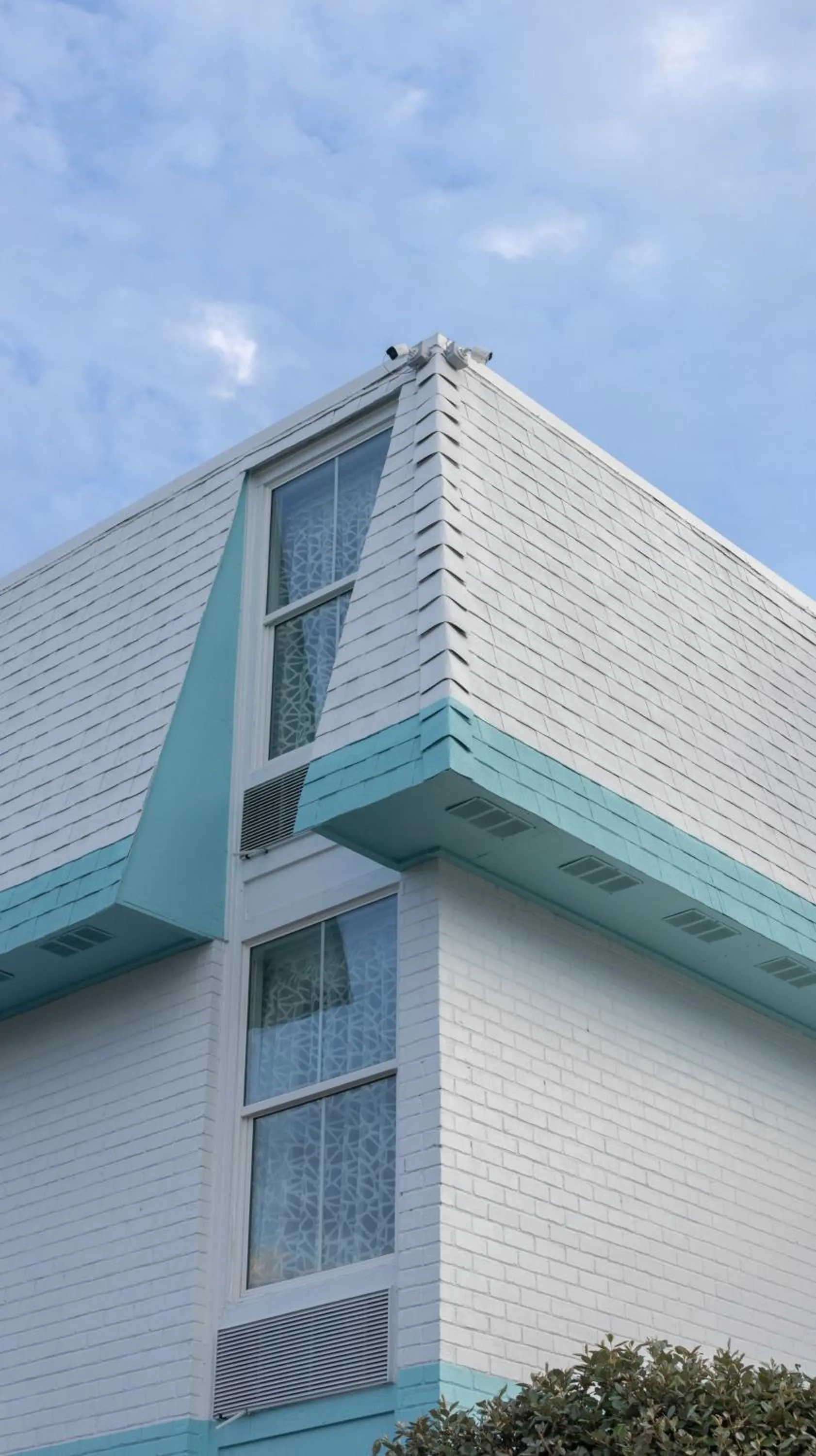 Property building in NEW 2026-Ocean Sands Beach Boutique Inn-Sauna and Salt-Mineral Pool -Free Beach Bikes and Famous Beach- Fresh Baked Cookies and Popcorn - Bathrobes and Sunscreen in all rooms-Ultra Sparkling-Free Laundry- 4 Grand Black Beds-Call NOW & Save-1-252-AHA-SAND