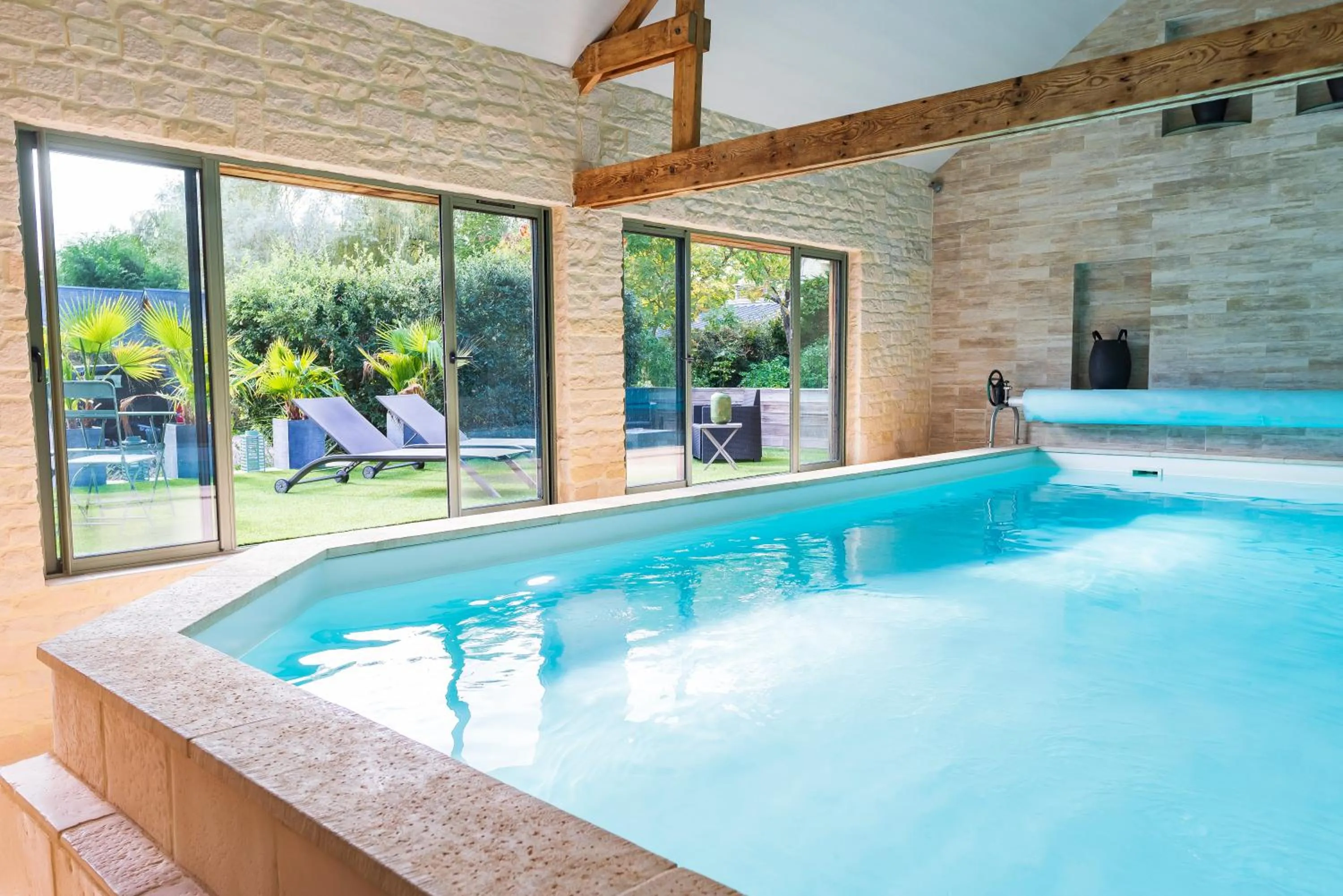 Swimming pool in La Ferme de l'Oudon & SPA
