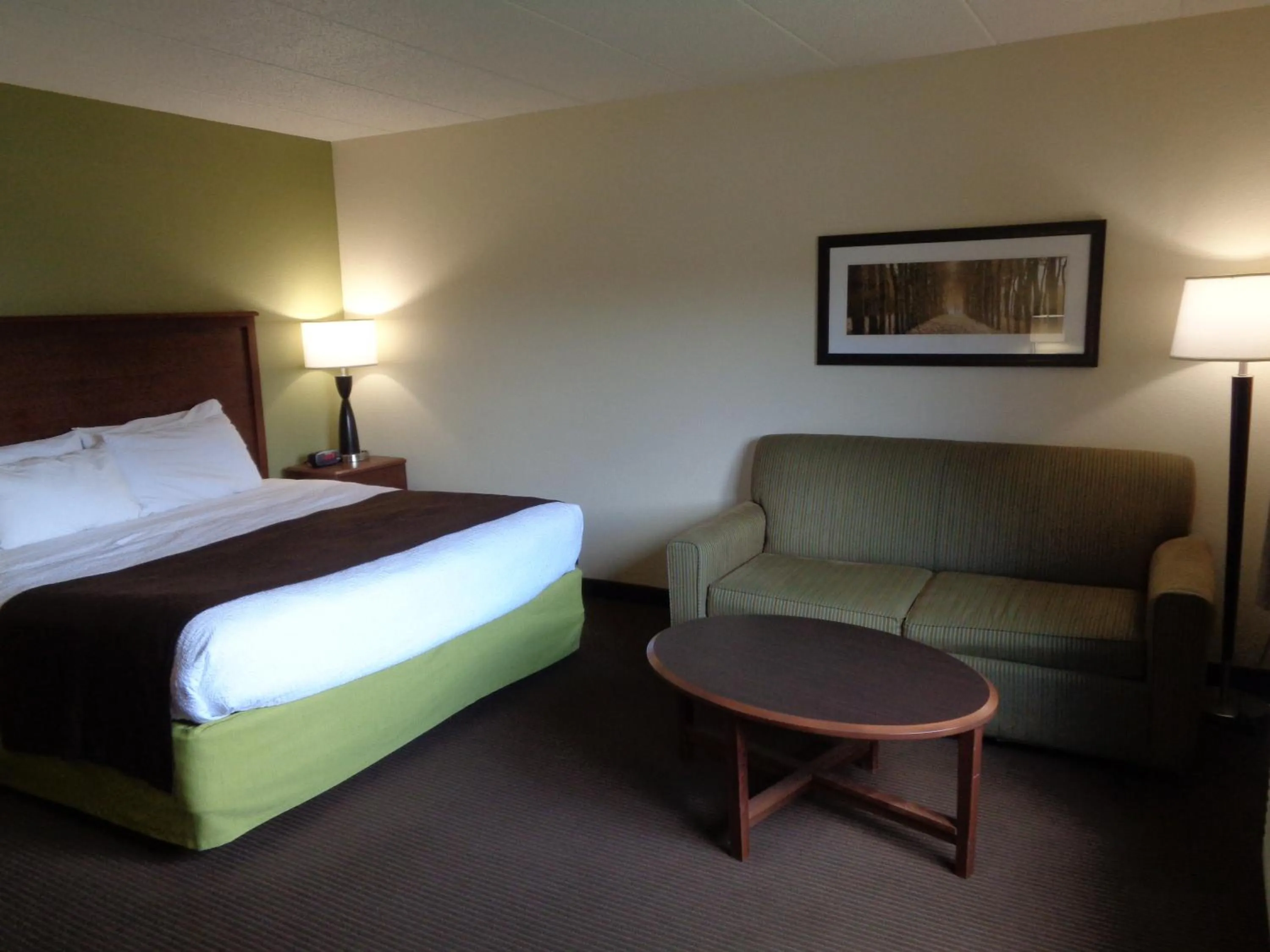 Bedroom in AmericInn by Wyndham Grand Rapids