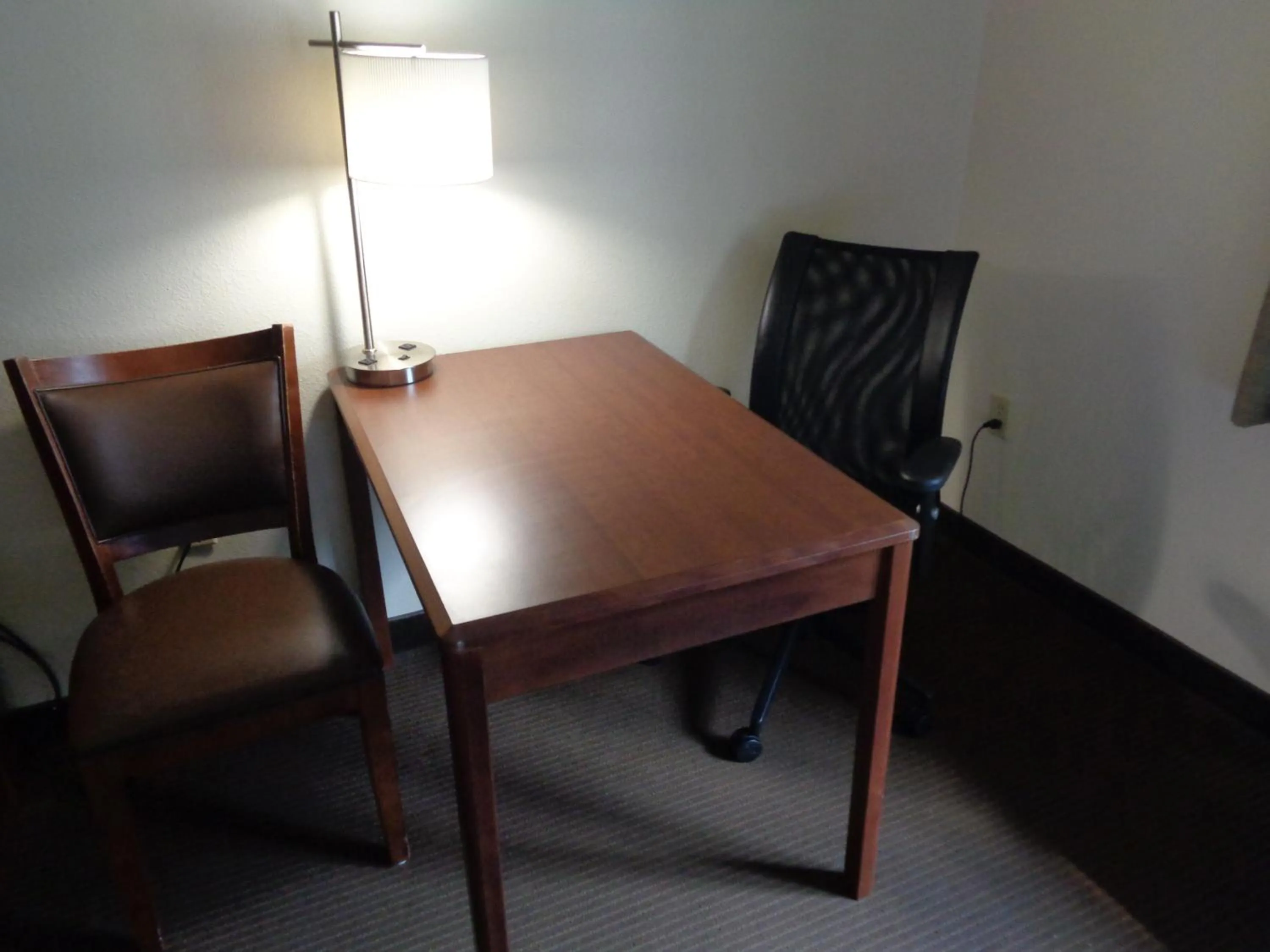 Seating area in AmericInn by Wyndham Grand Rapids