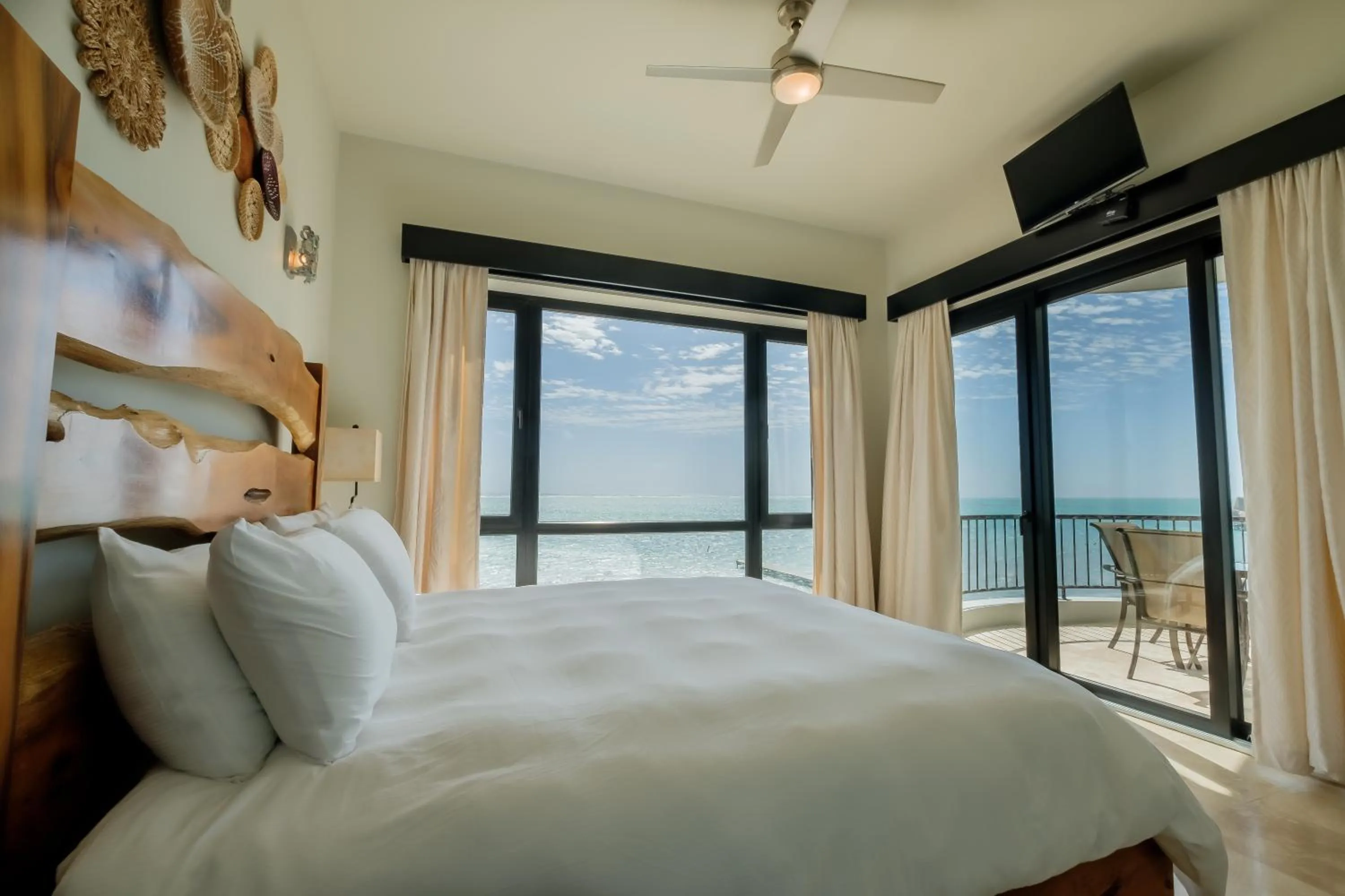 Bed in Diamante Beachfront Suites