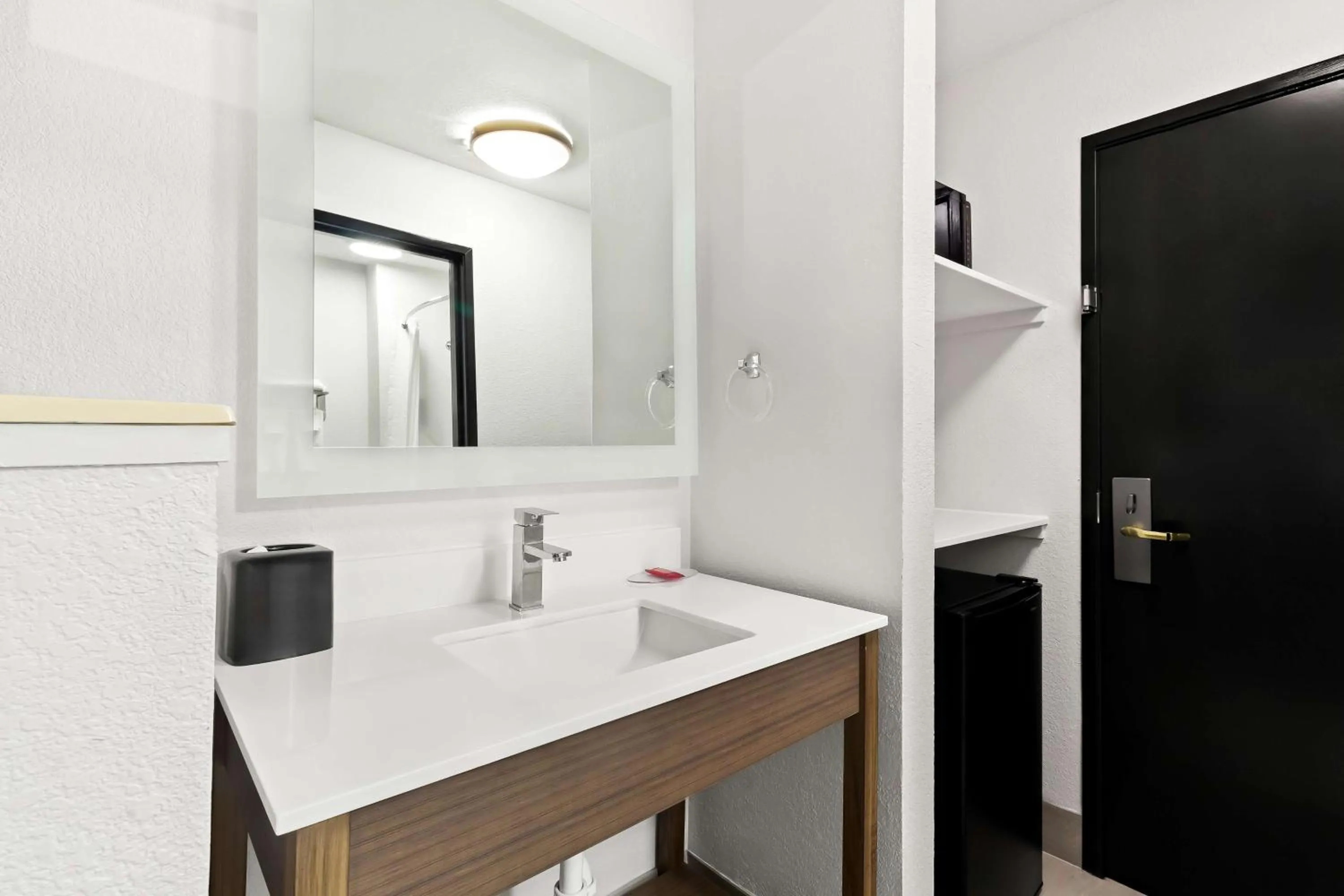 Bathroom in SureStay Hotel by Best Western Groves