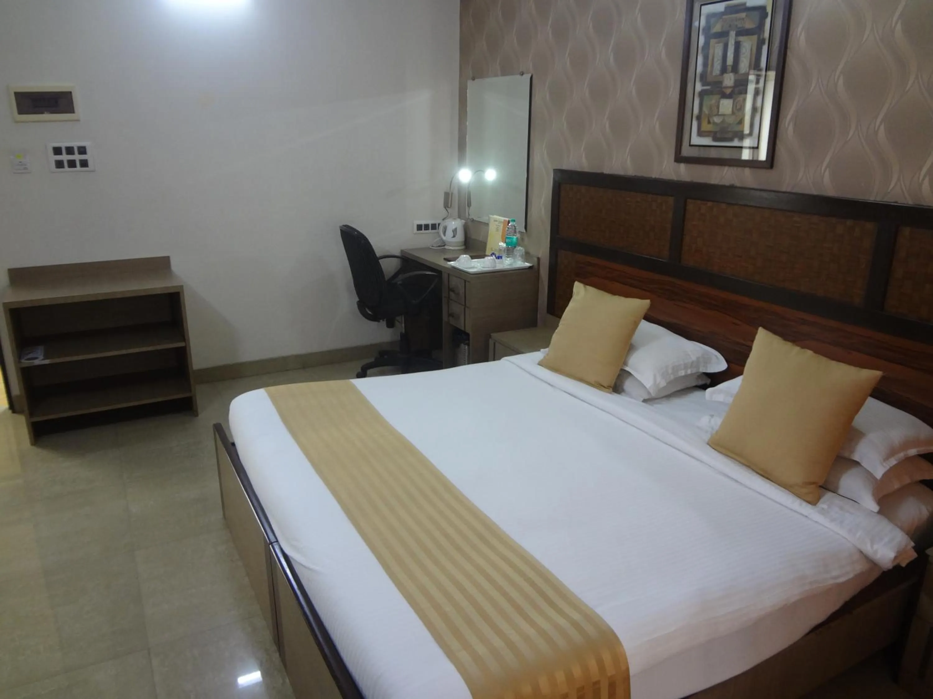 Bed in Jyoti Dwelling Hotel